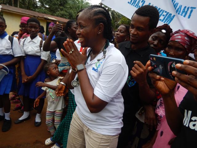 Dr. Kadija greeting community members