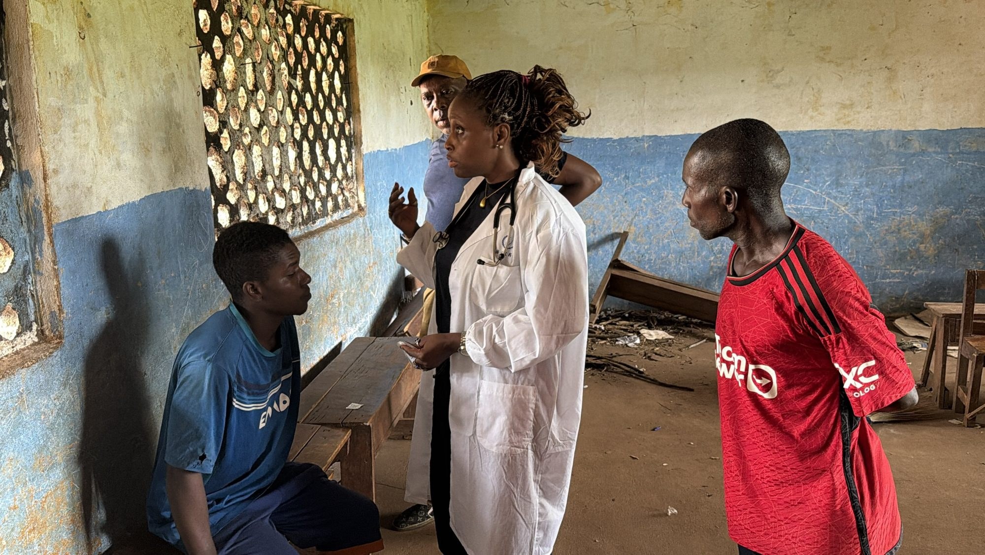 A MaCHO clinician speaking with a young patient and family