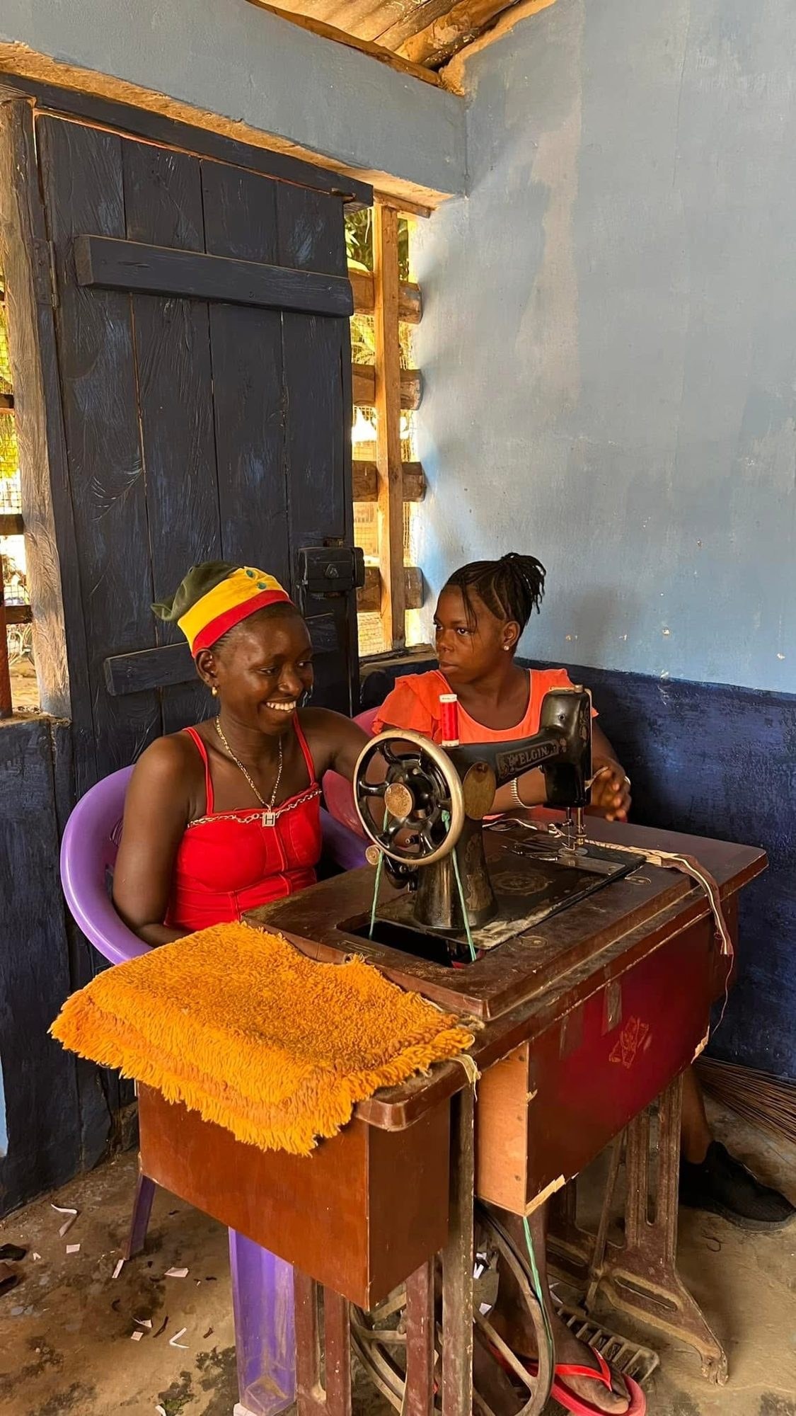 Women learning to sew at the Women’s Empowerment Center