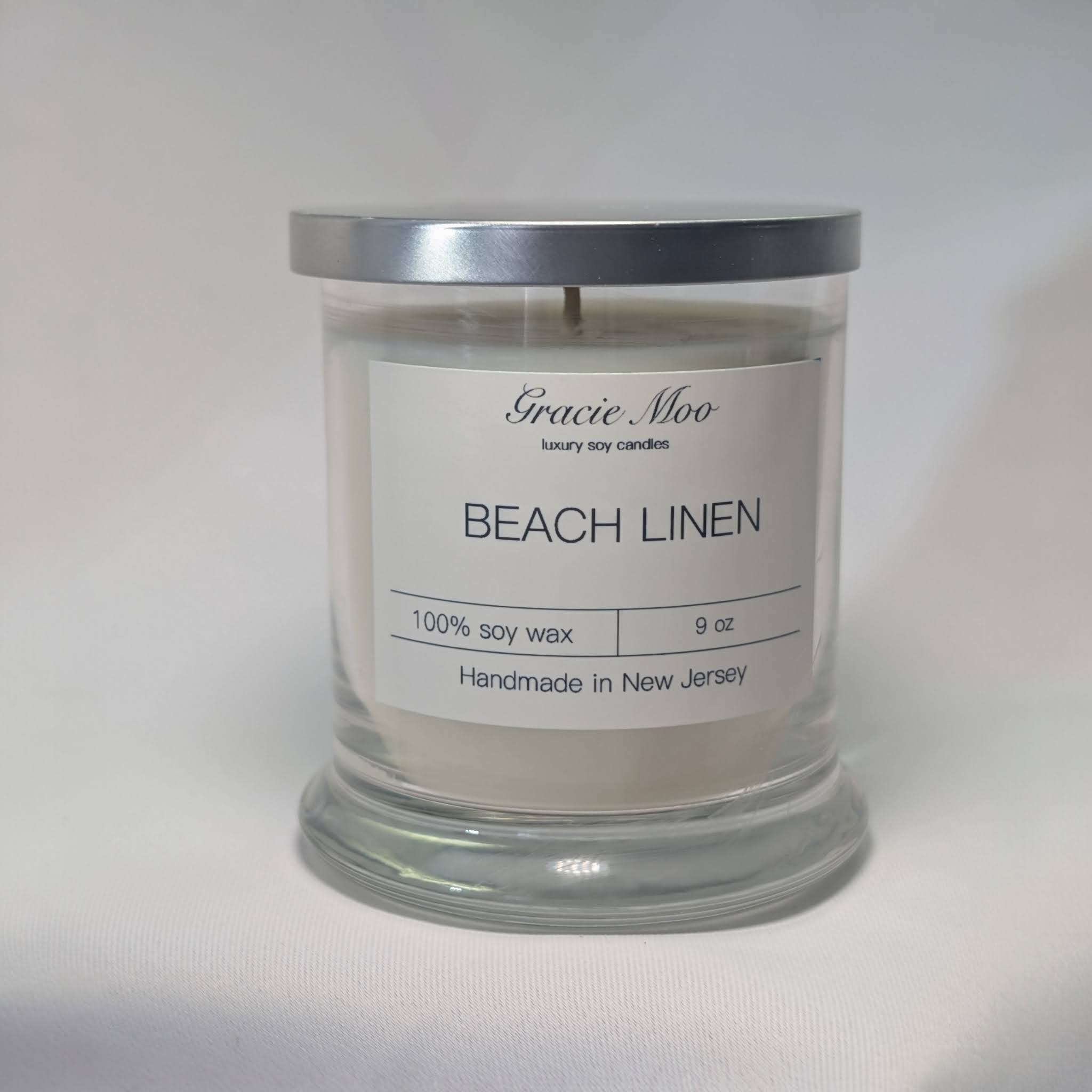 Candle and linen in soft morning light