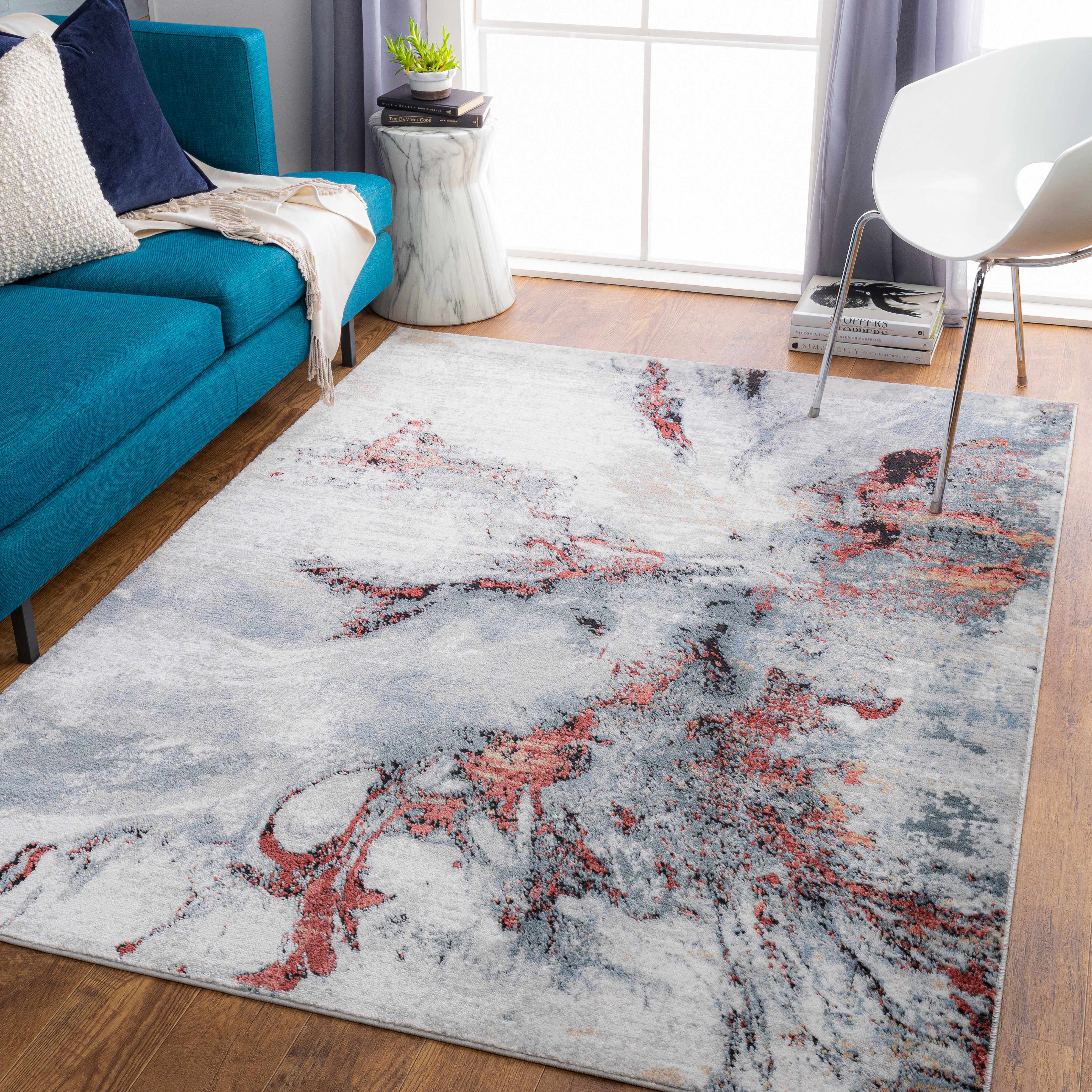 Contemporary living room grounded by a patterned area rug