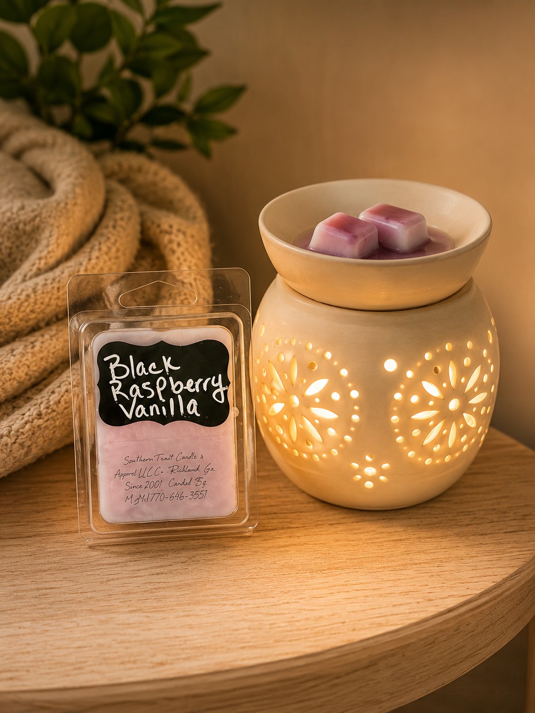 Southern Twist Black Raspberry Vanilla wax melts beside a lit wax warmer