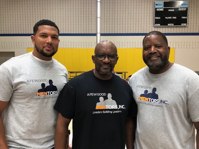 Three men wearing A Few Good MENtors apparel