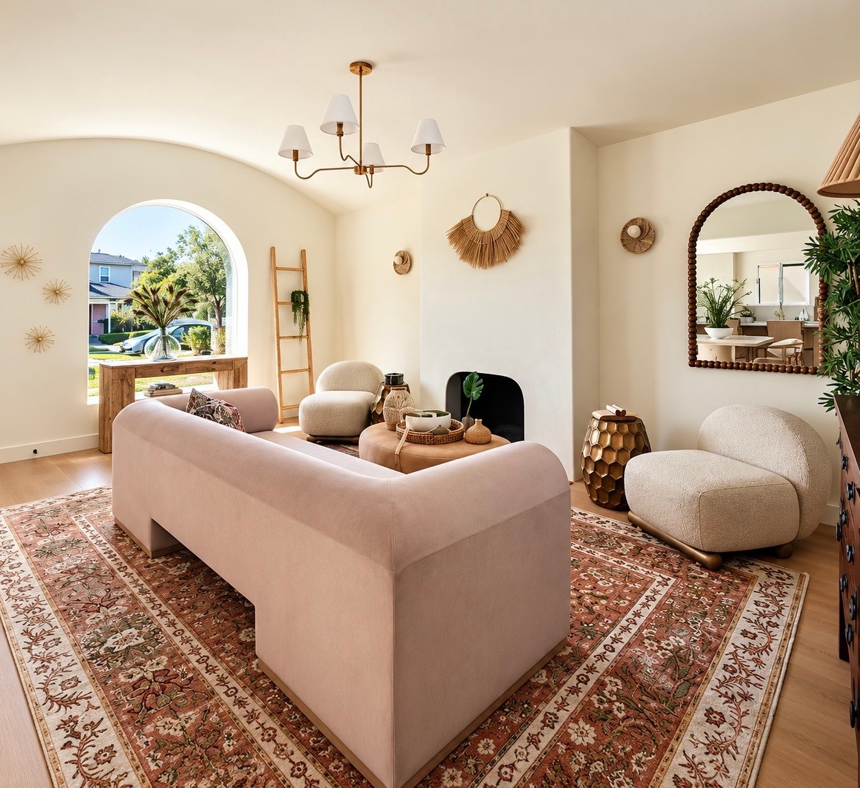 Warm staged living room with arched windows, soft seating, and textured accents