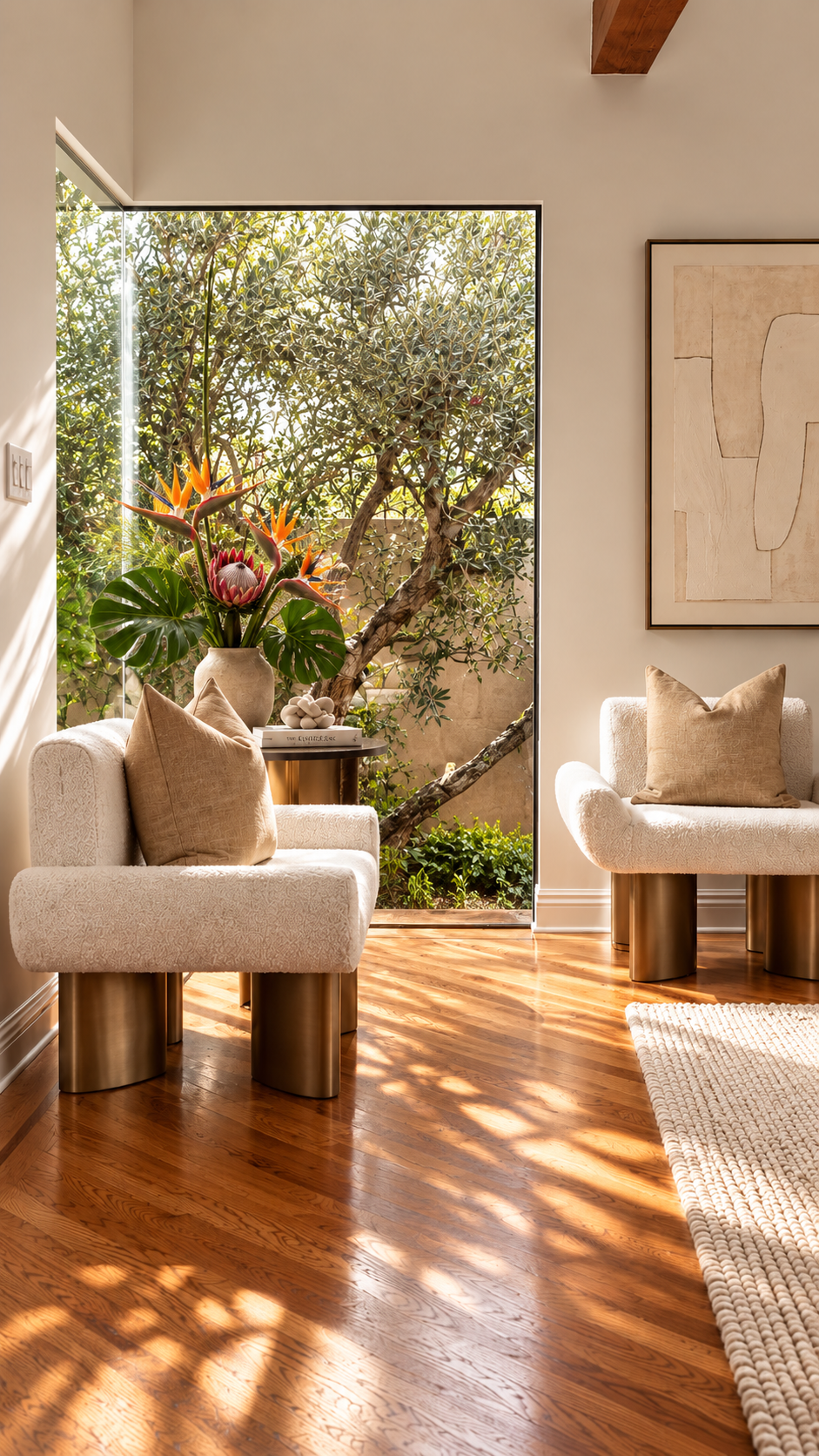 Two upholstered accent chairs in a sunlit interior