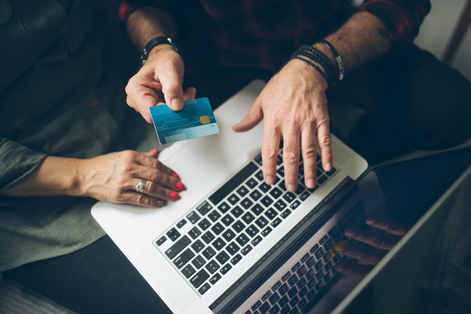 An older couple reviewing financial information together at home
