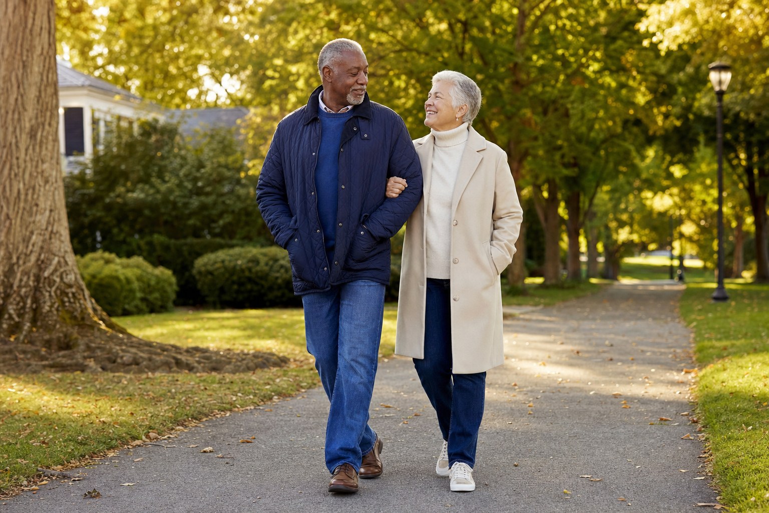 An older couple walking together in a park