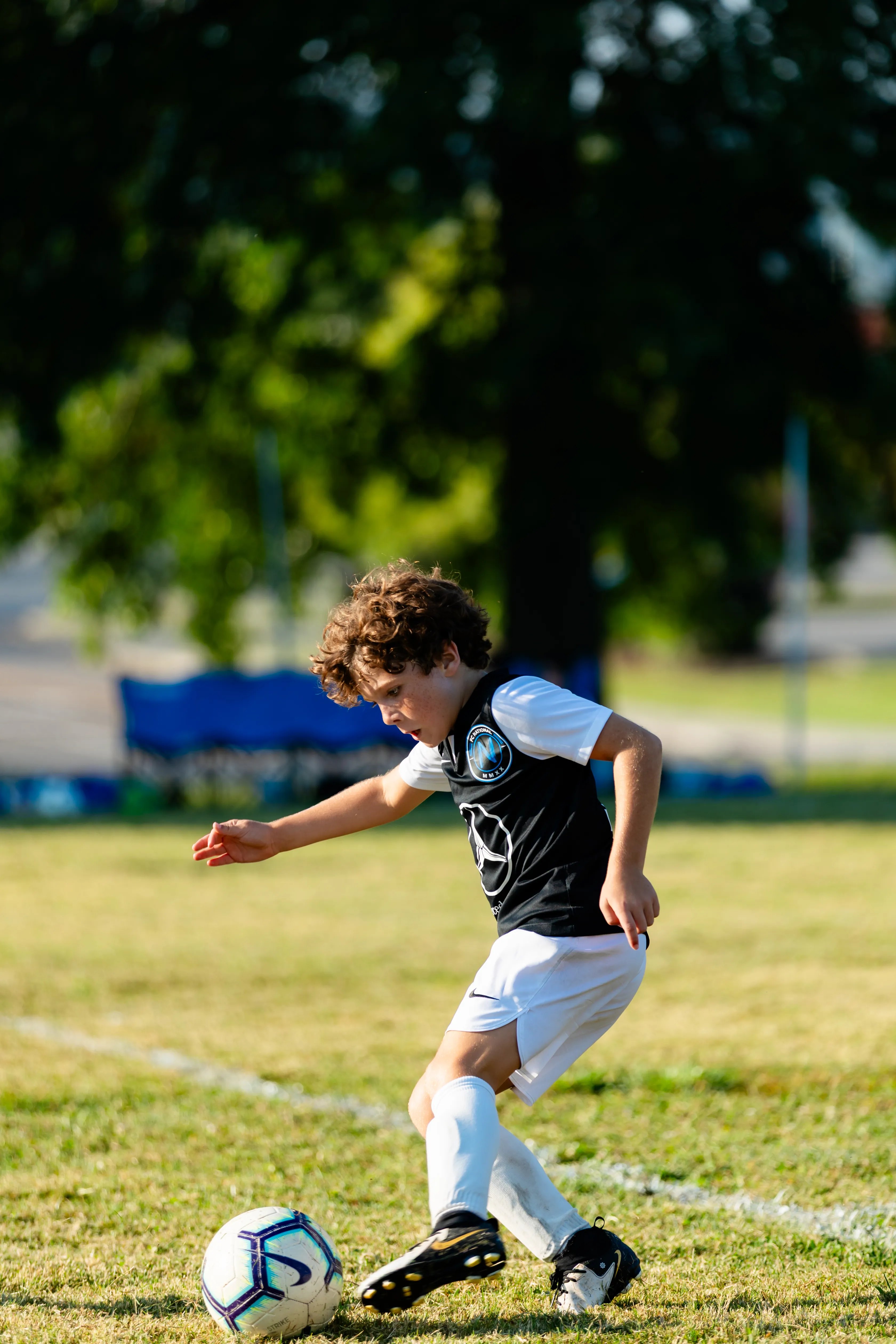 Young FC National player sprinting with a soccer ball