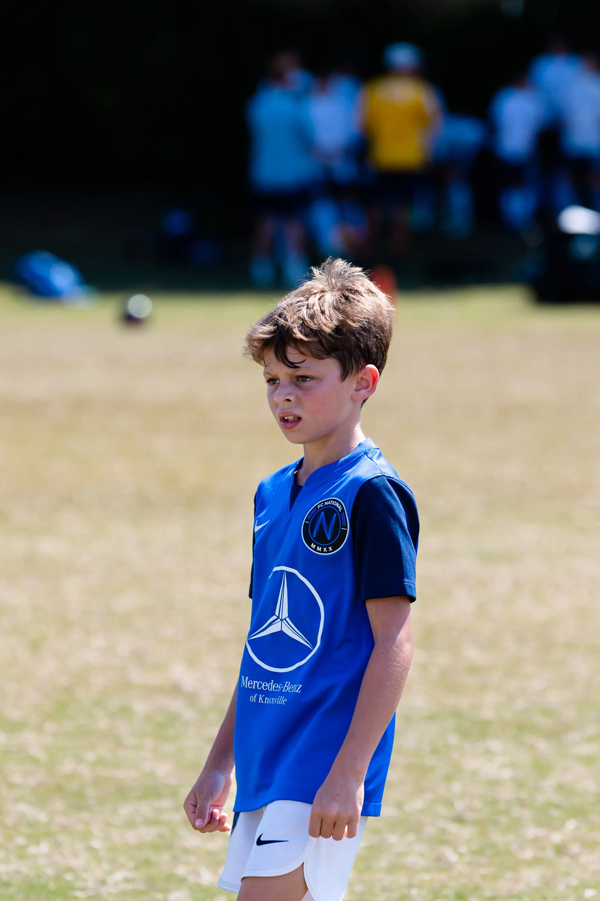 Focused FC National player controlling the ball at training