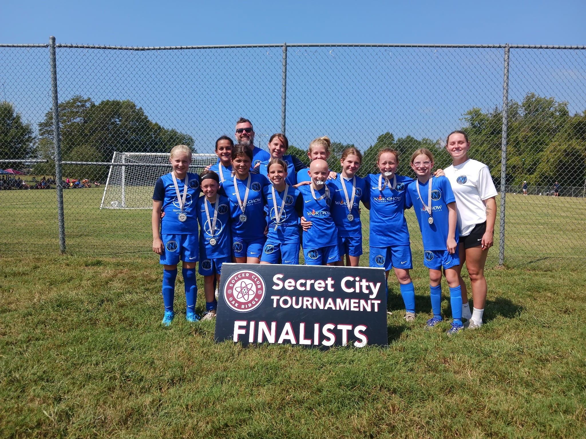 FC National U12 Girls pictured with their Secret City Tournament Finalists sign