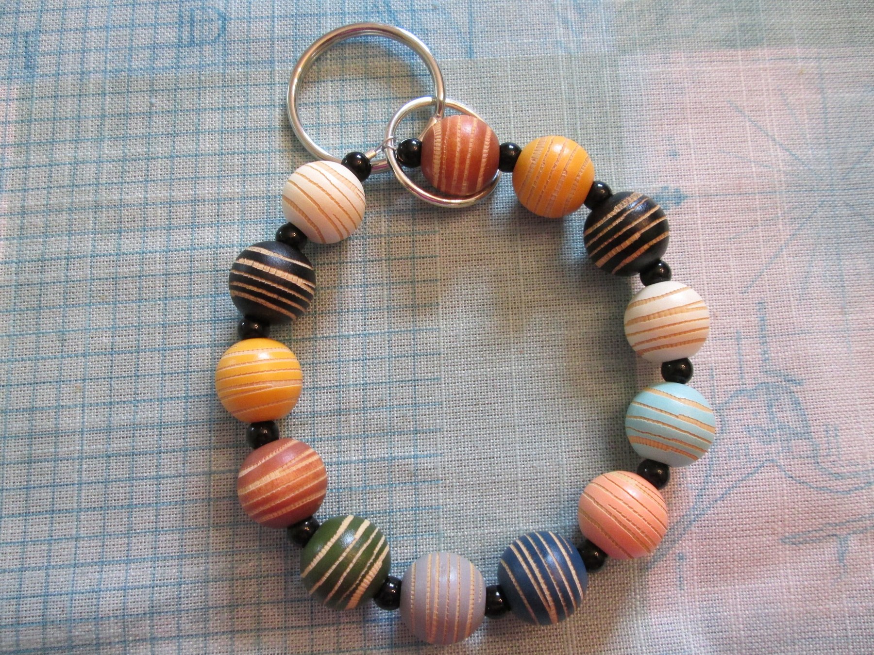 Bracelet Lanyard, wristlet, dyed round wood beads, 1995