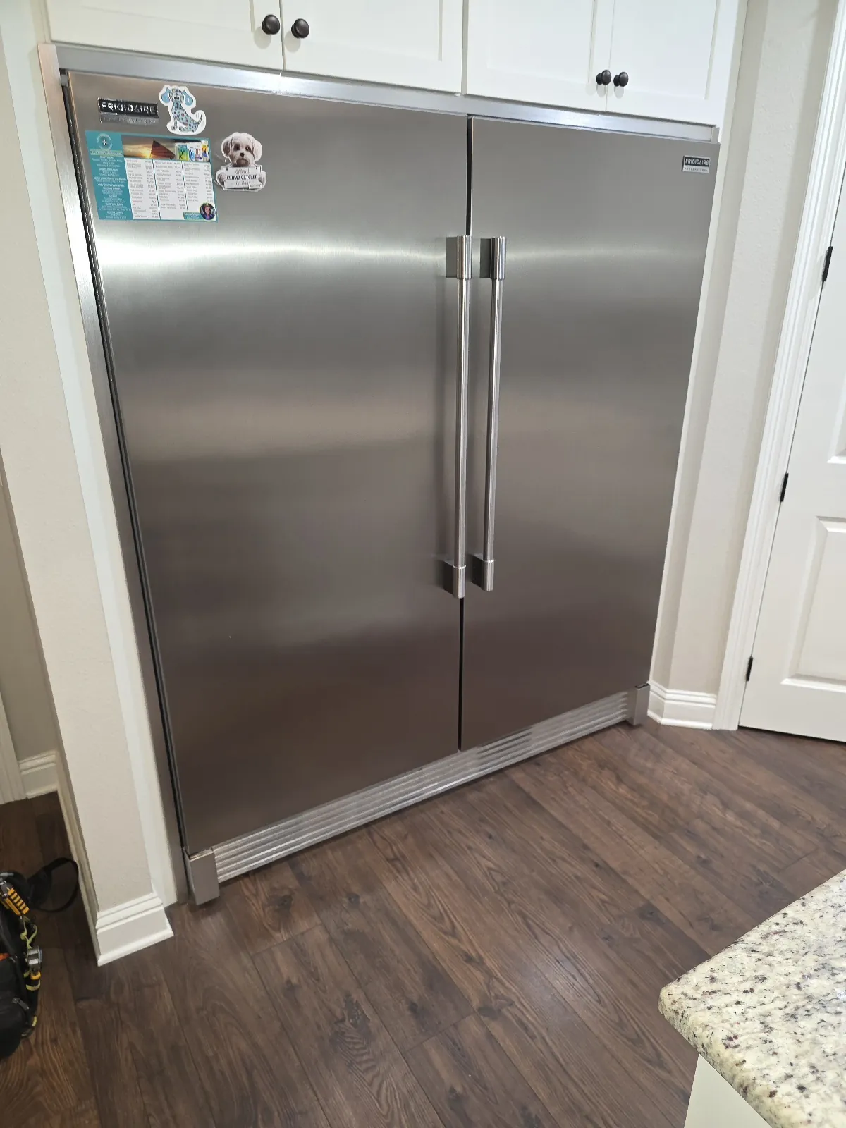 Built-in stainless refrigerator in a customer’s kitchen