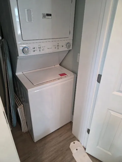 Laundry center with a washer and dryer in one compact assembly