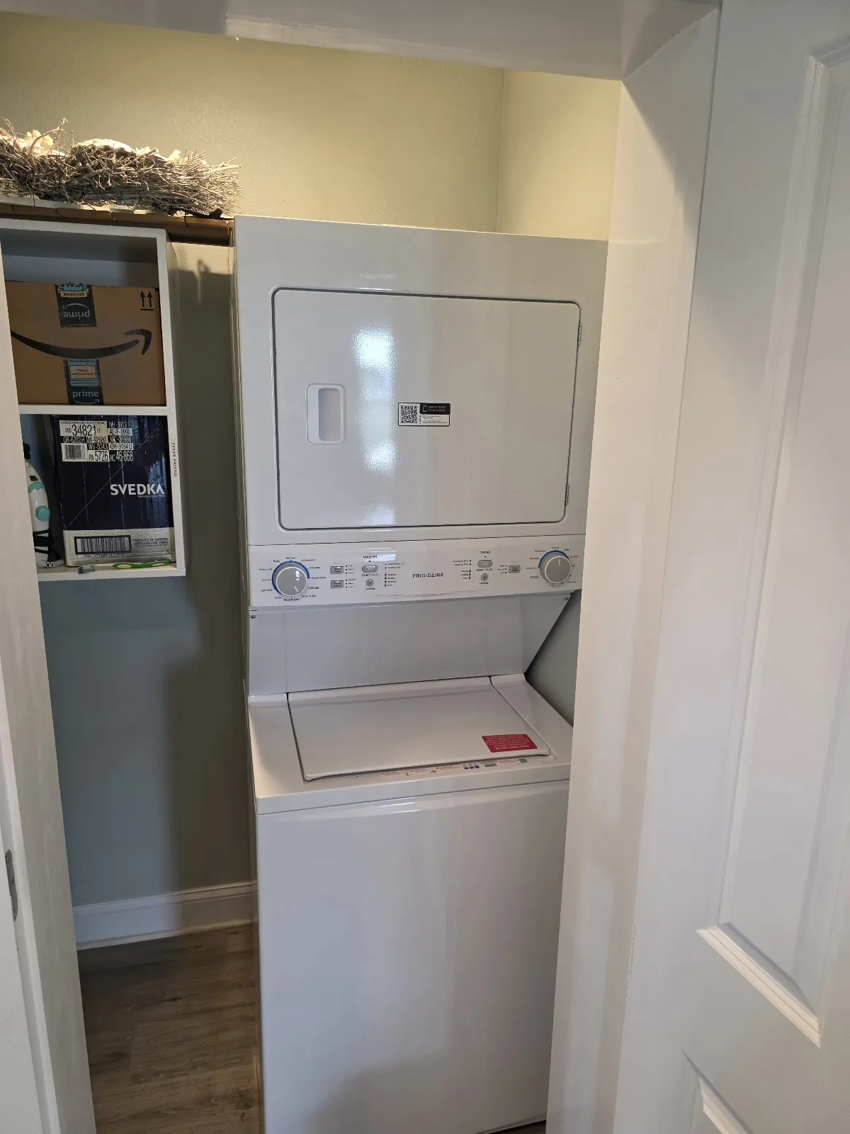 Laundry center with a washer and dryer in one compact assembly