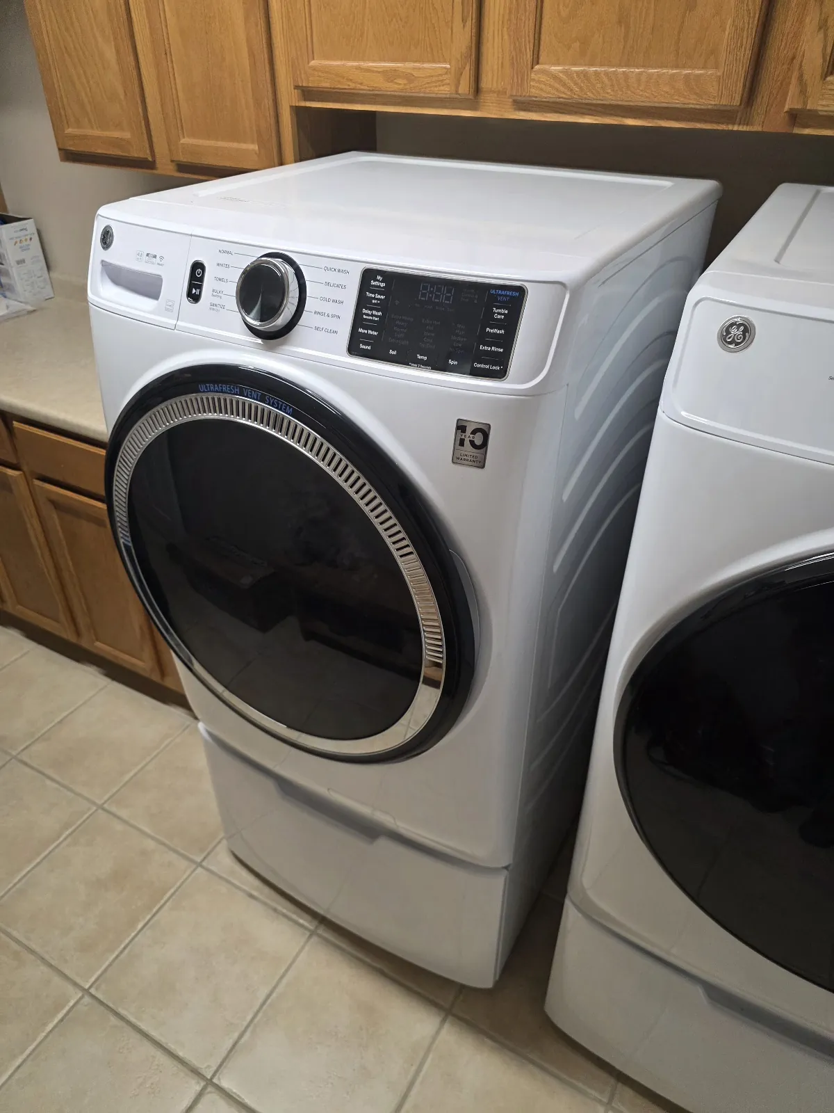 Washer and dryer pair in a home laundry room