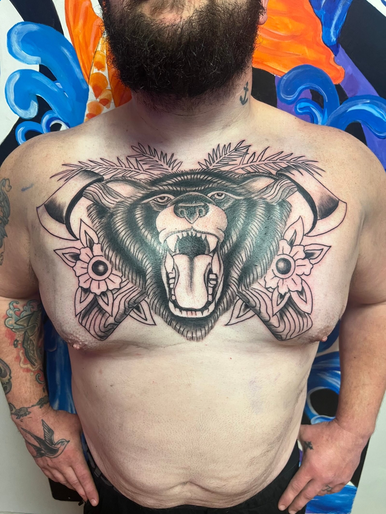 Traditional bear and axes tattoo by Joe Kennedy
