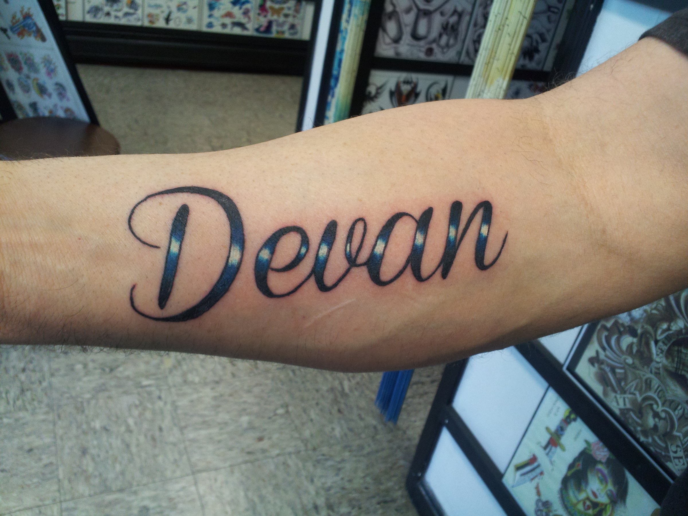 Devan script tattoo by Joe Kennedy