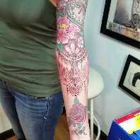 Ornamental floral sleeve tattoo by Joe Kennedy