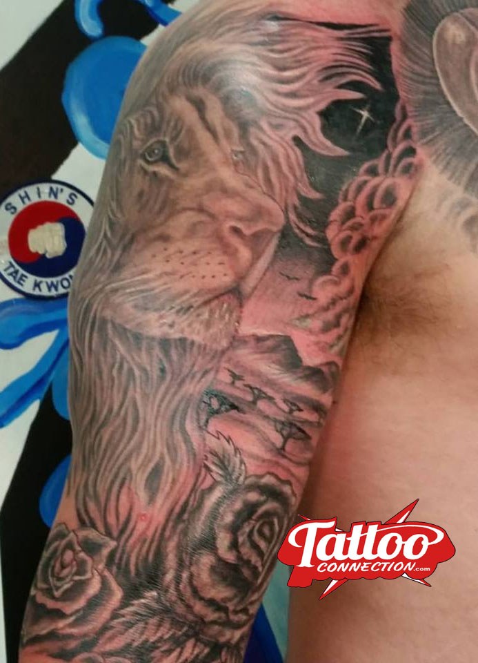 Lion portrait tattoo by Joe Kennedy
