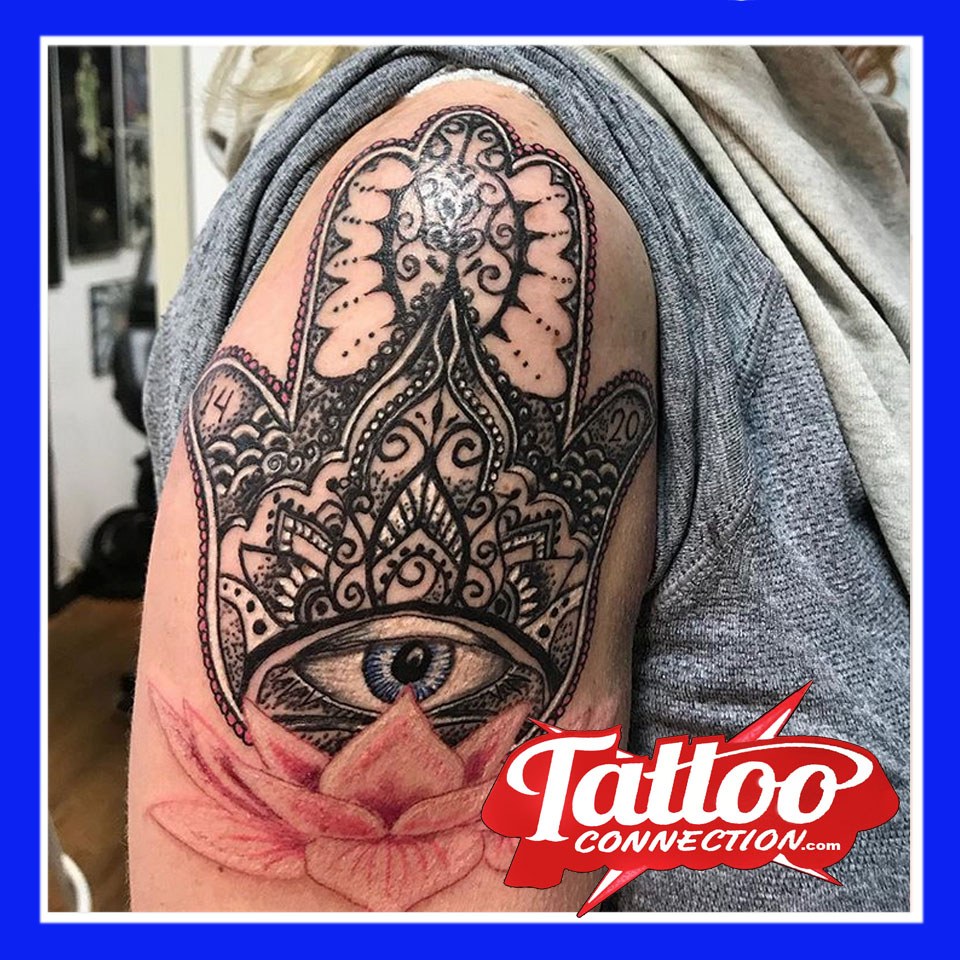 Lotus and Hamsa tattoo by Joe Kennedy