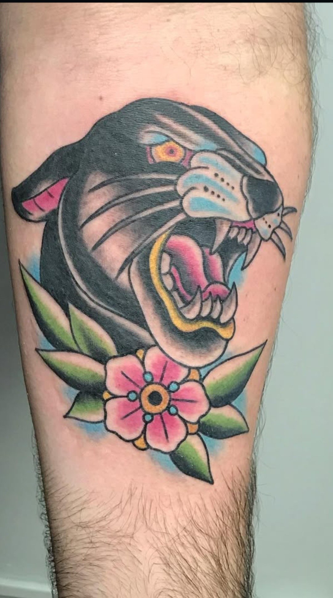 Colorful panther head tattoo by Rob Scotti