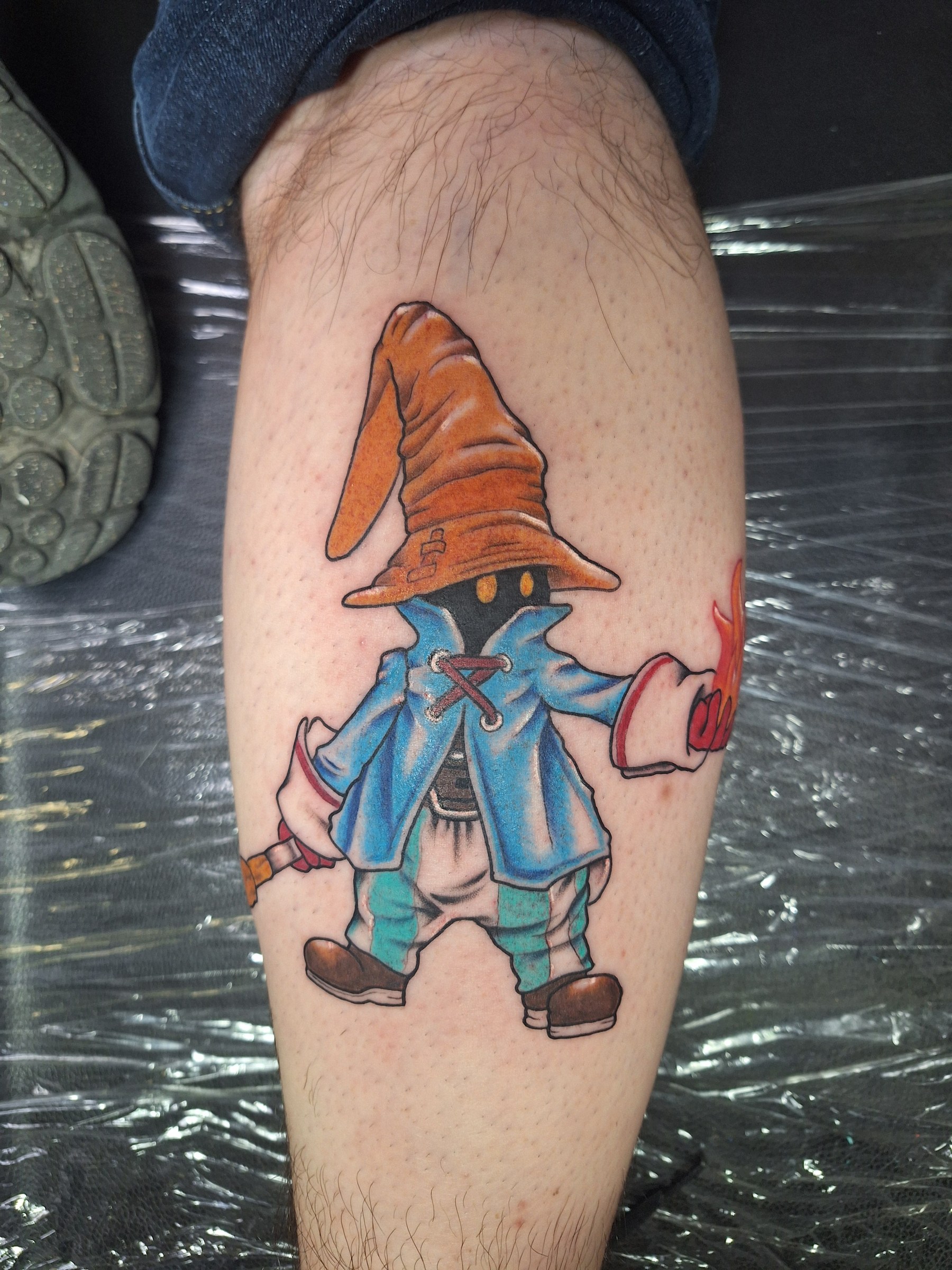 Colorful wizard tattoo by Rob Scotti