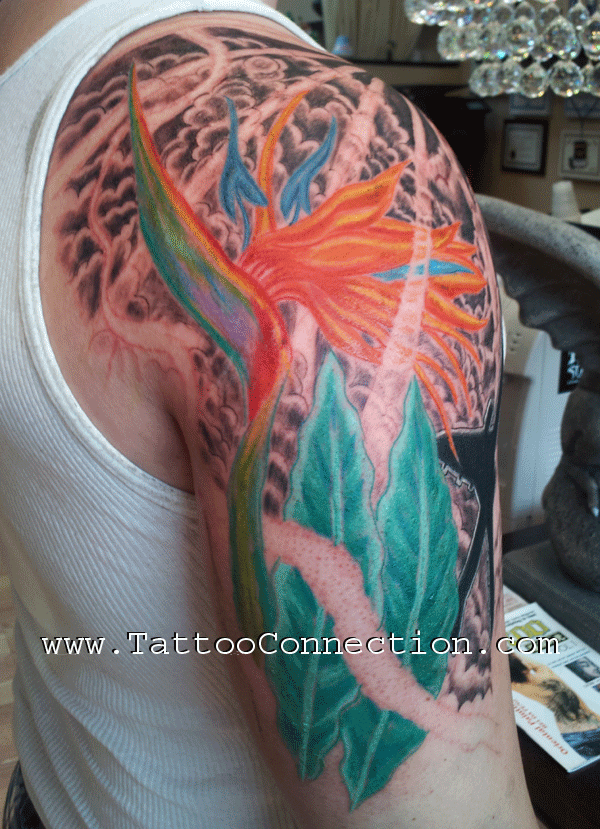 Bird-of-paradise flower shoulder tattoo by Joe Kennedy