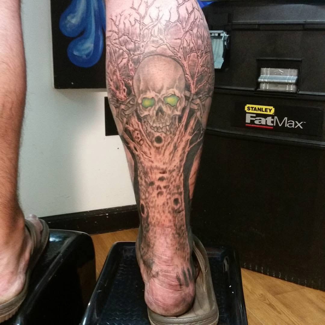 Detailed black and gray sleeve tattoo by Joe Kennedy