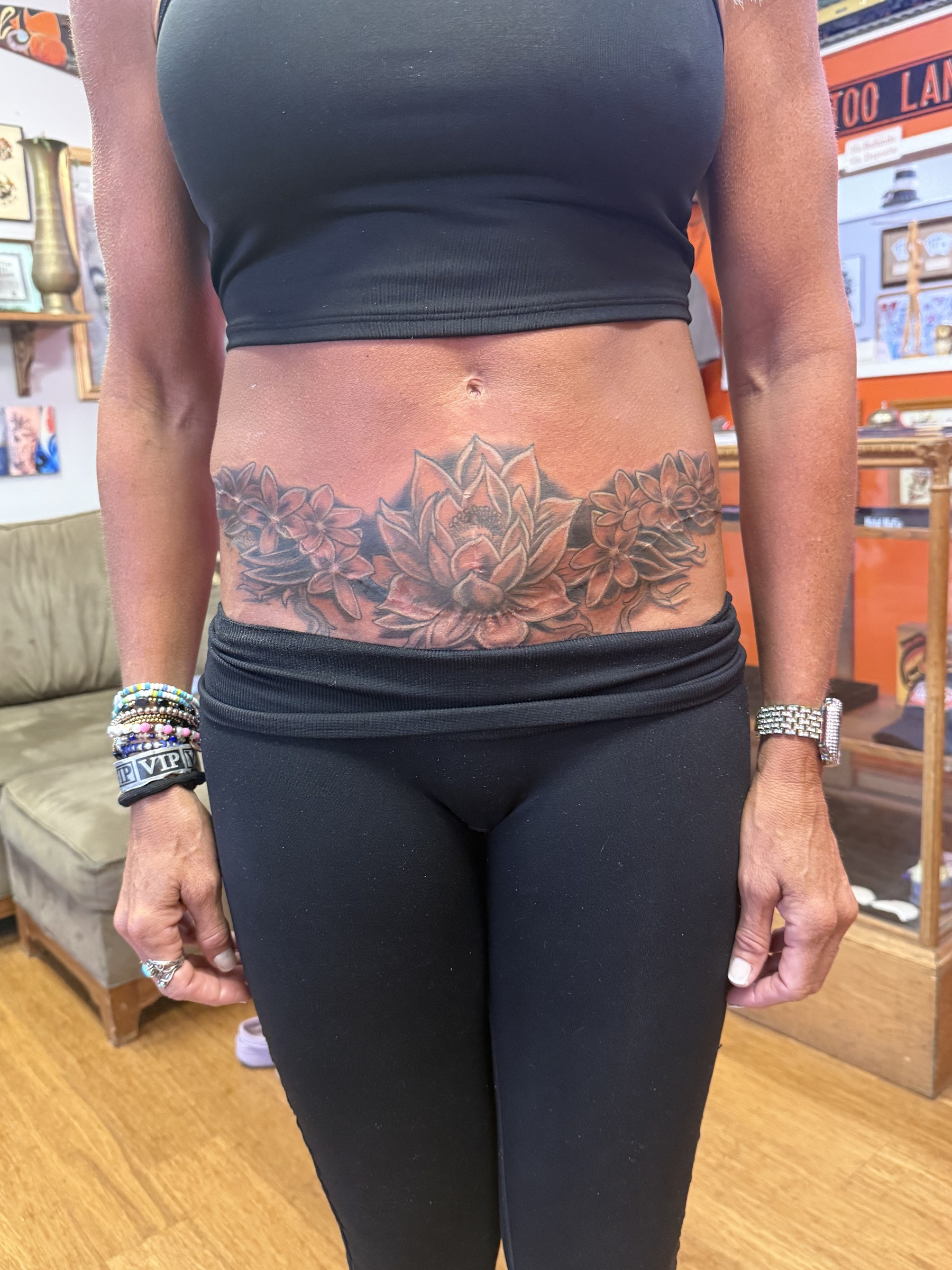Black and gray rose sleeve tattoo by Joe Kennedy