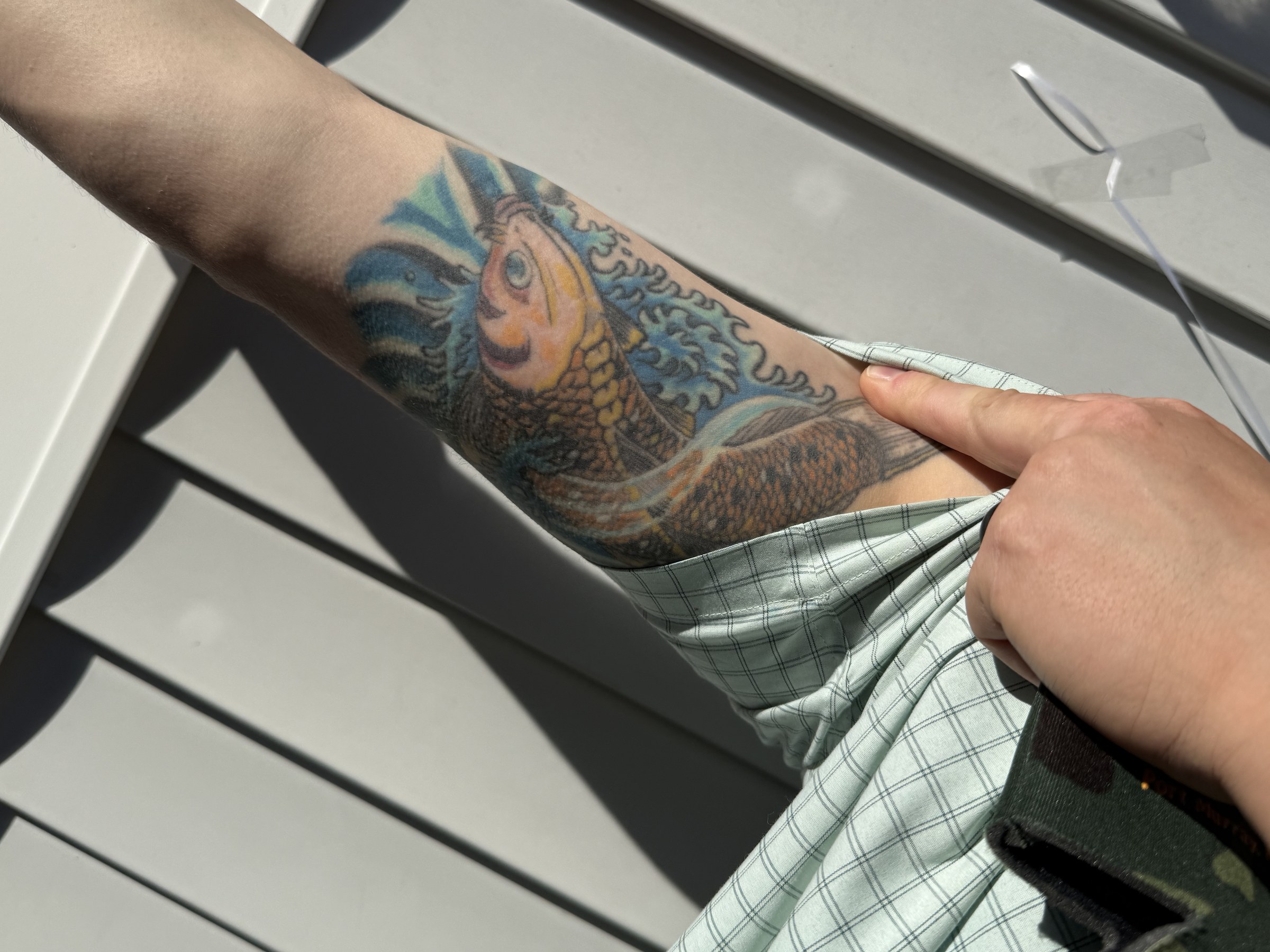 Colorful lower-leg tattoo by Joe Kennedy