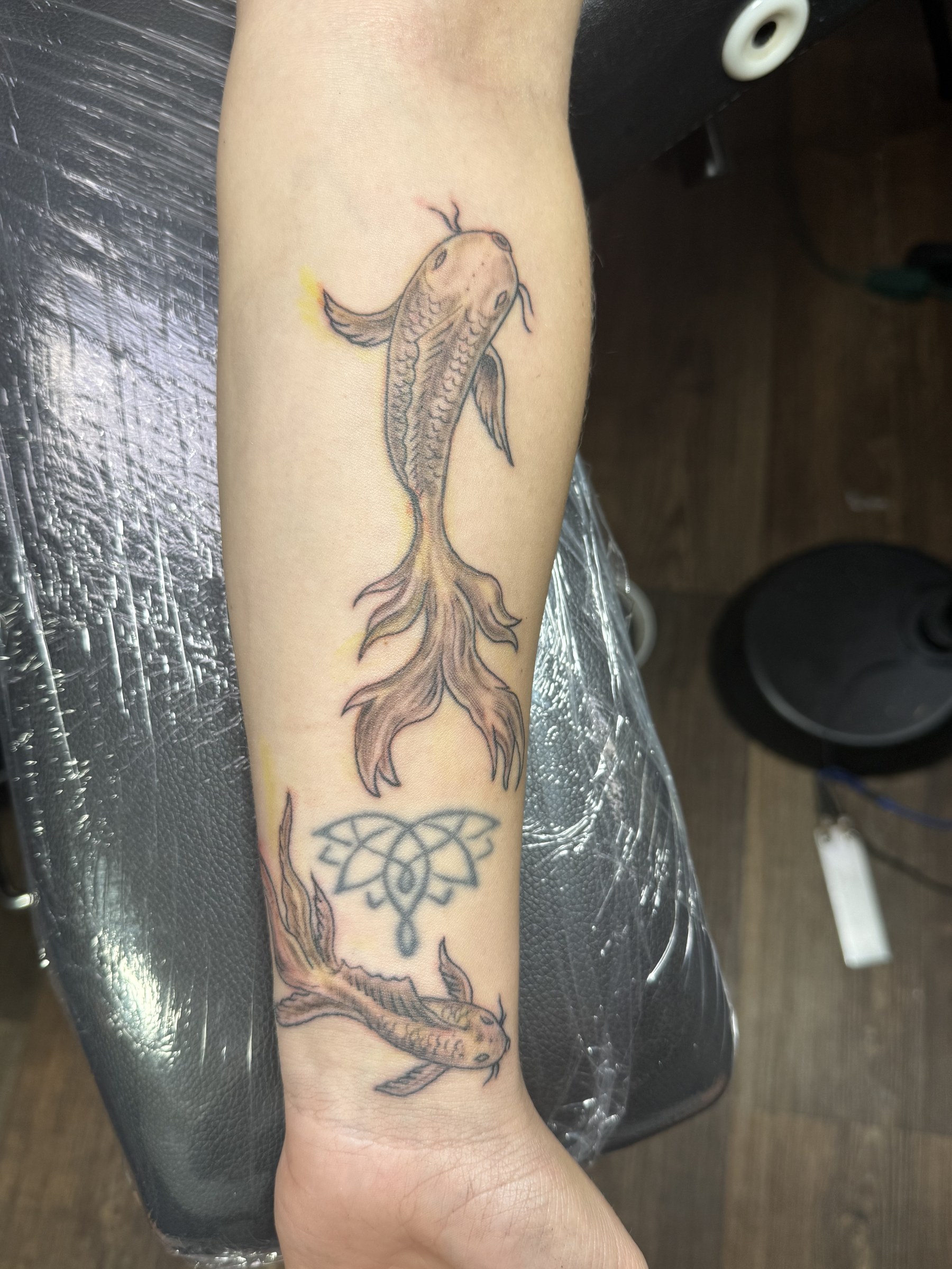 Blackwork whale and floral forearm tattoo by Joe Kennedy