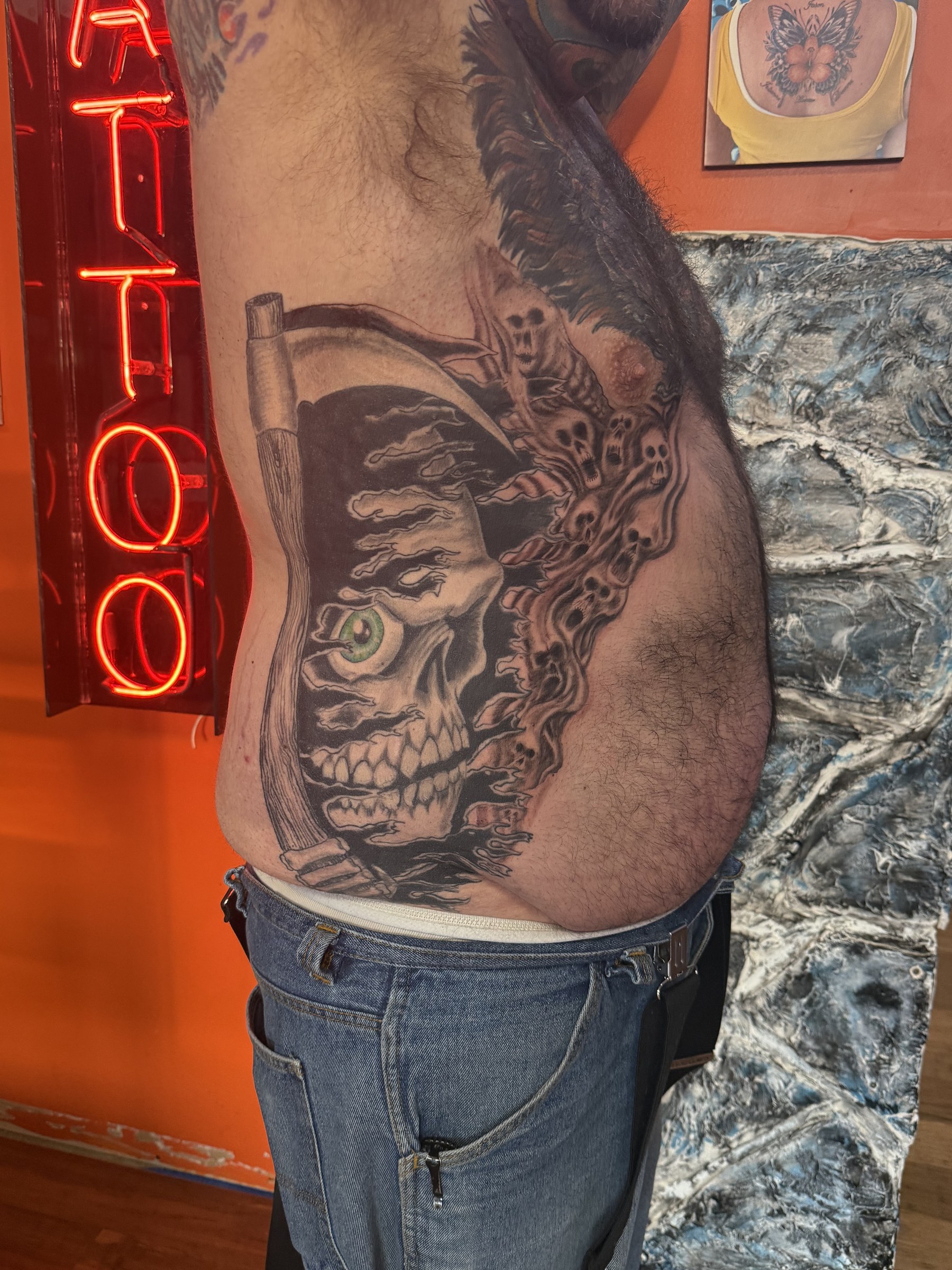 Black and gray wildlife thigh tattoo by Joe Kennedy