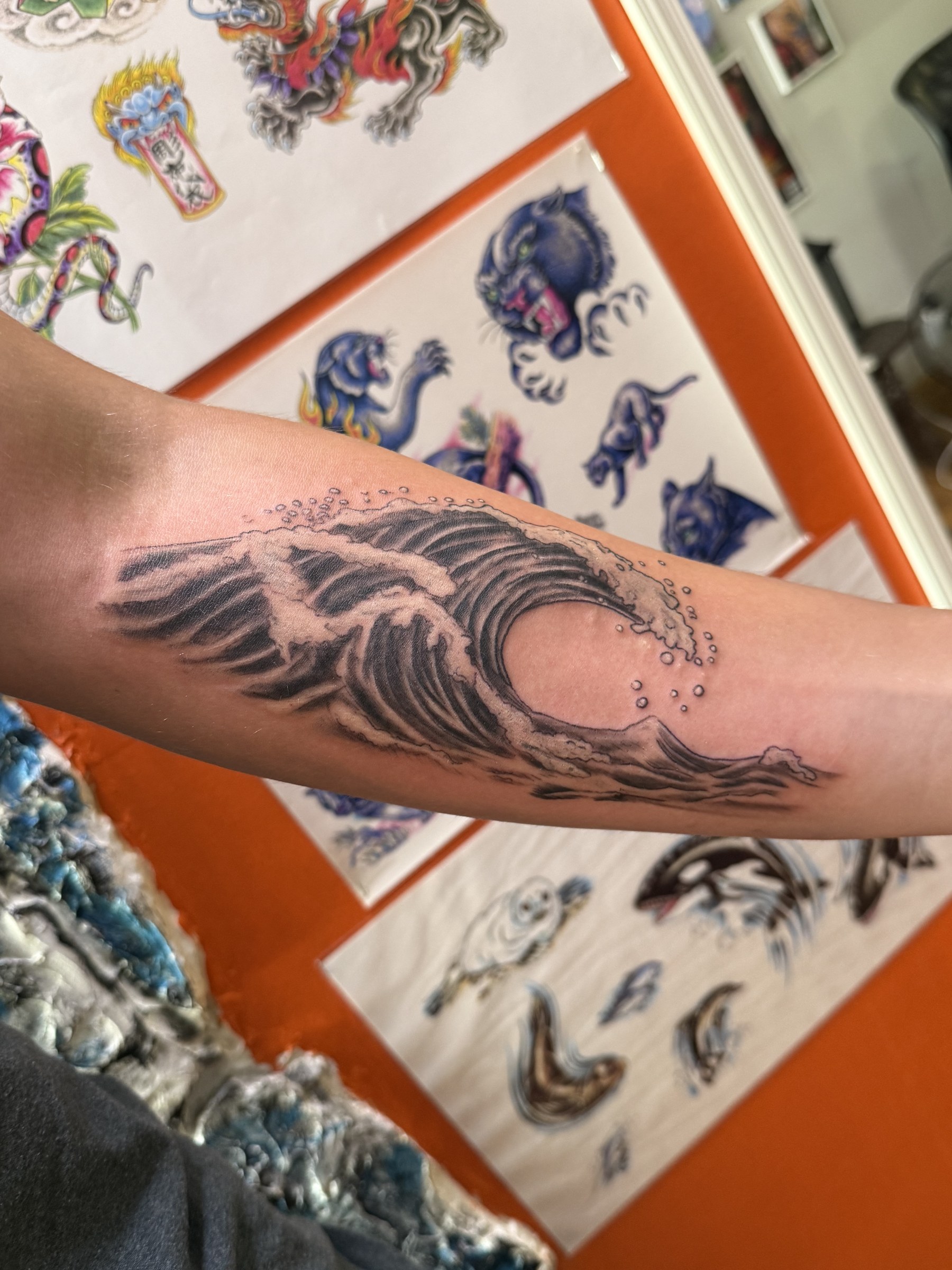 Blackwork raven forearm tattoo by Joe Kennedy