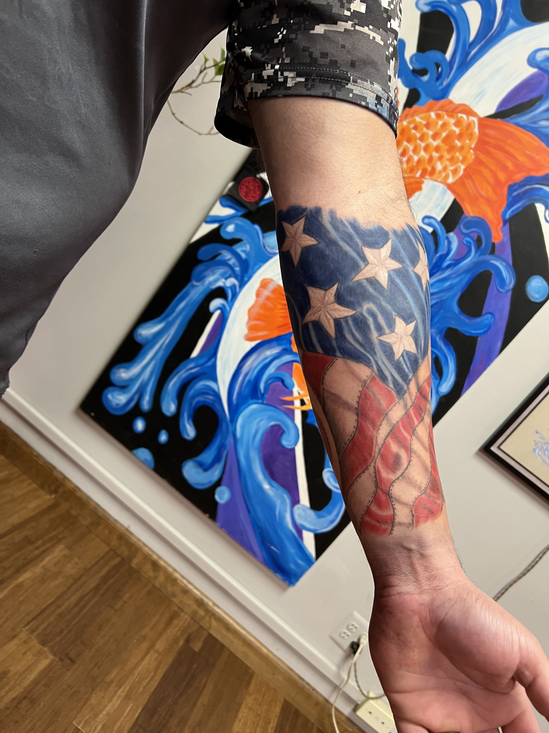 Patriotic forearm tattoo by Joe Kennedy