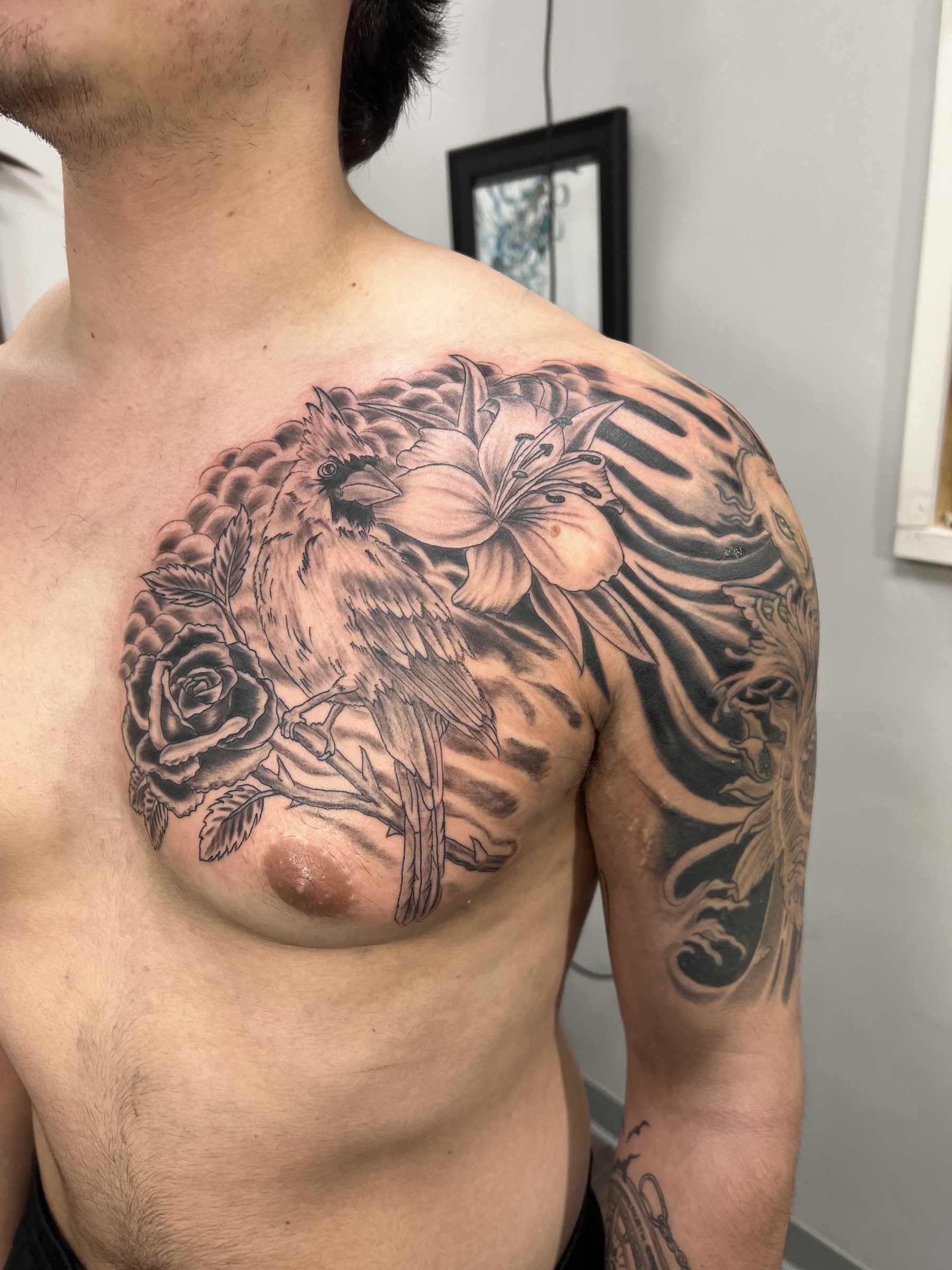 Black and gray chest tattoo by Joe Kennedy