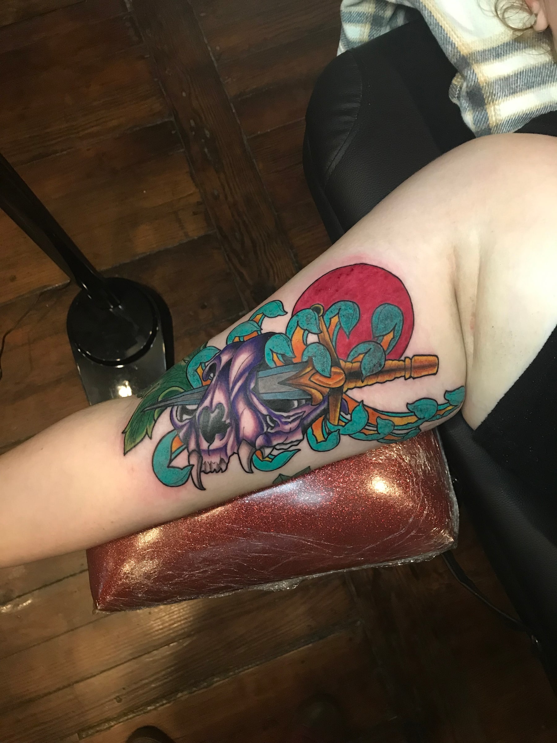 Purple skull and swords tattoo by Rob Scotti