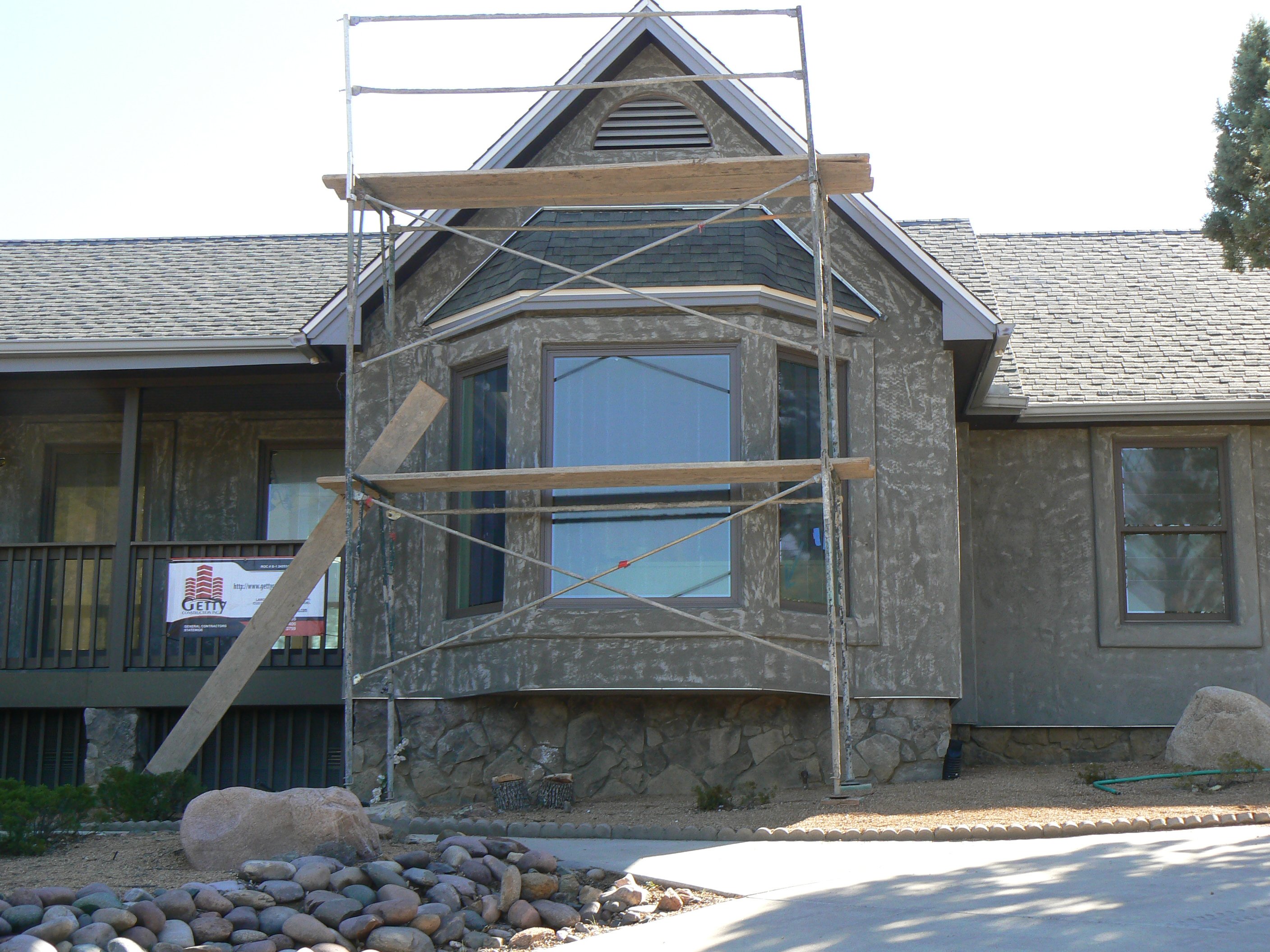 Ranch house renovation exterior during construction