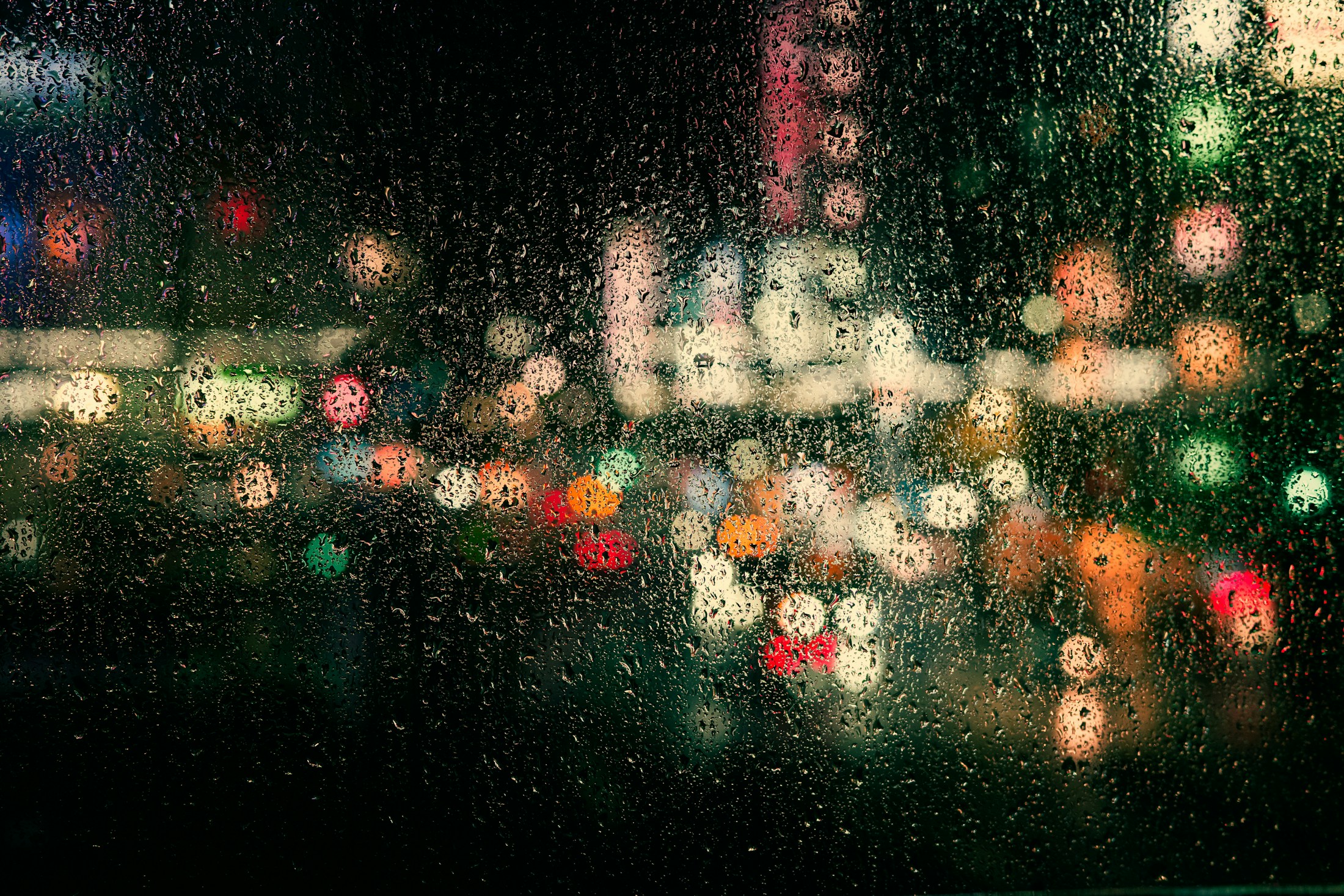 Blurred city lights on a rainy night