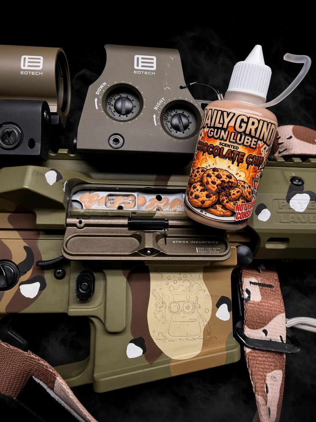 Daily Grind Chocolate Chip Gun Lube bottle resting on a rifle