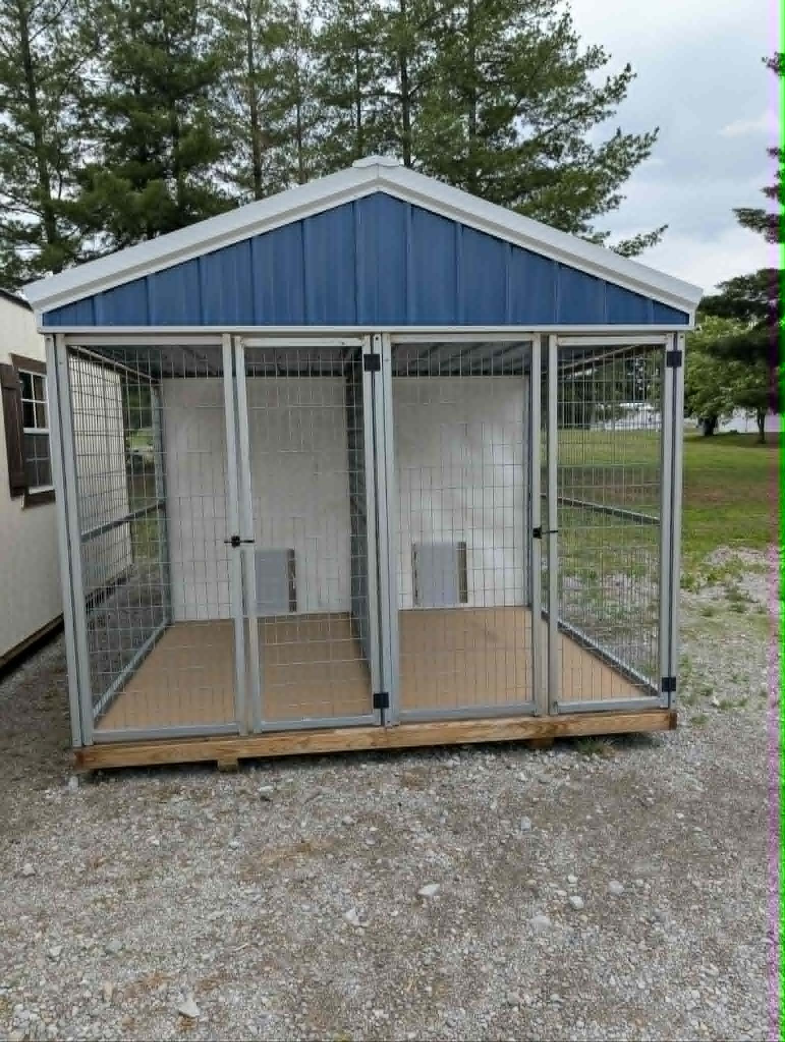 Blue portable building with enclosed run