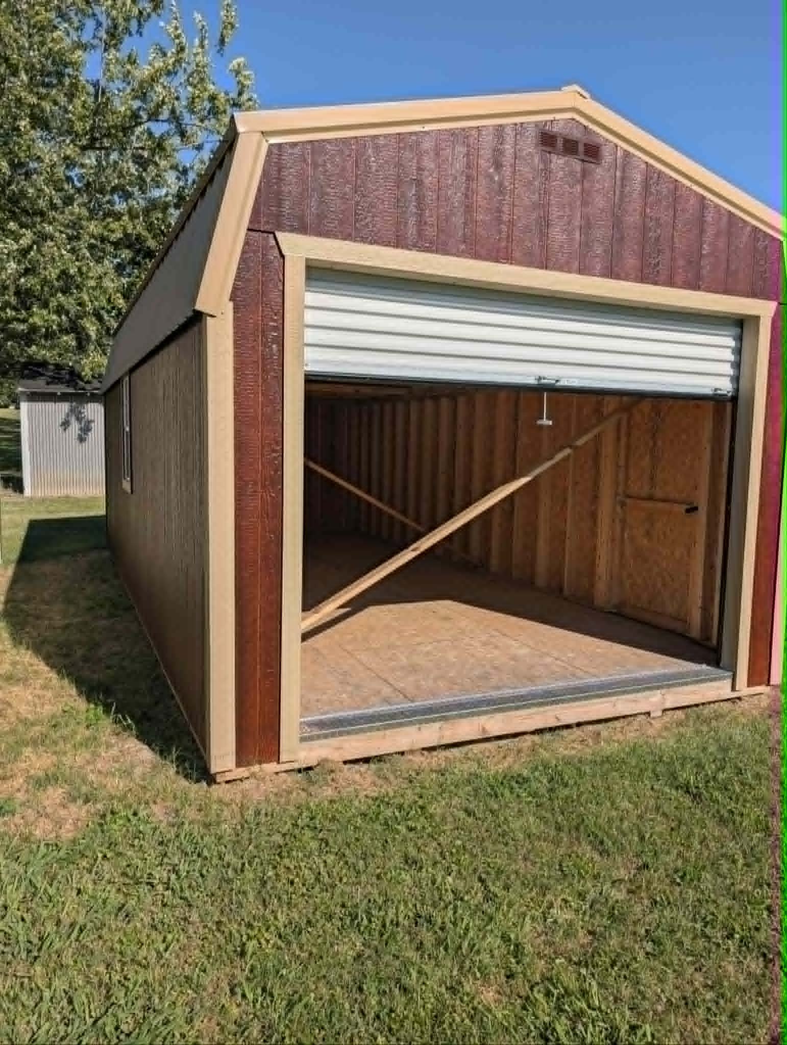 Portable garage with roll-up door