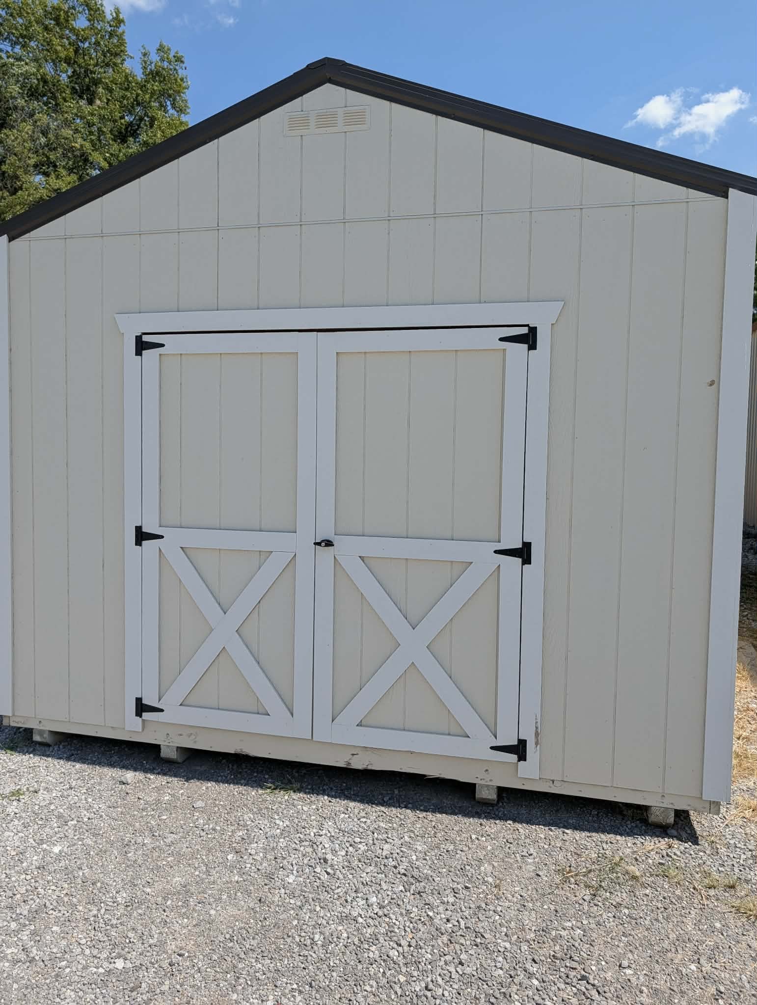 White portable shed with double doors