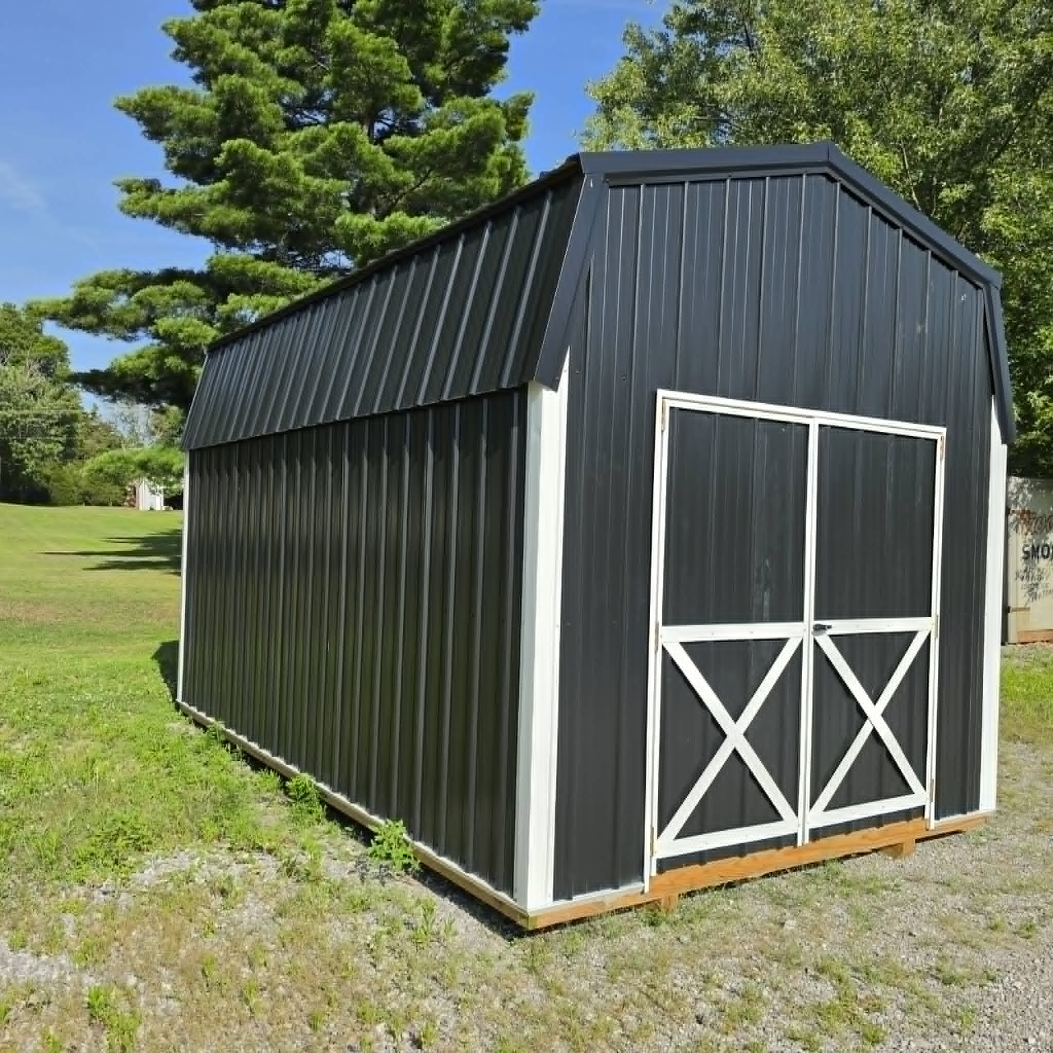 Black barn-style portable building