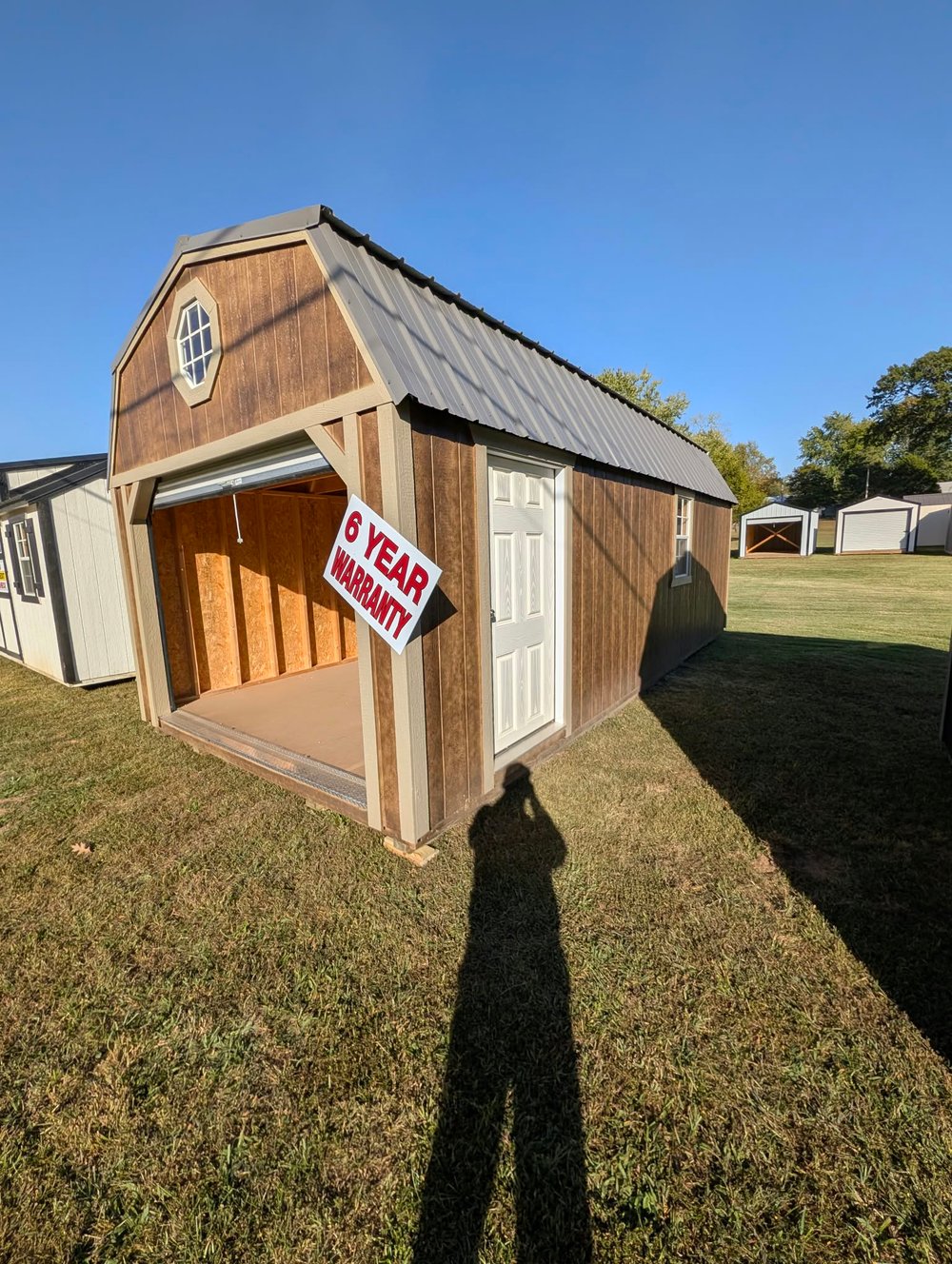 Brown Prairie Built lofted garage with a roll-up door and side entry