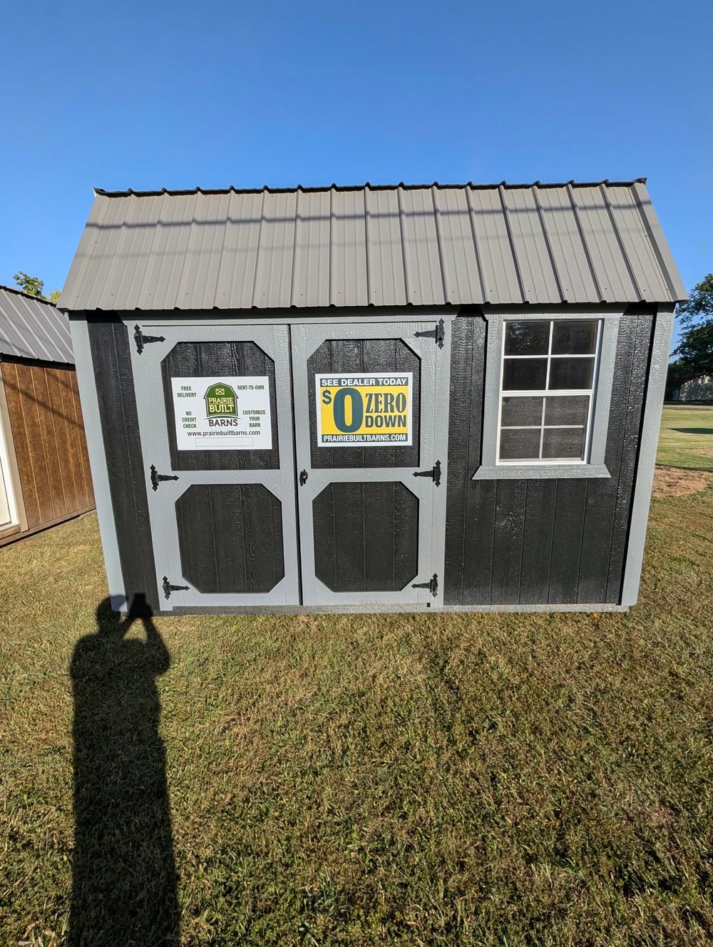 Gray Prairie Built side lofted barn with double shop doors and one window