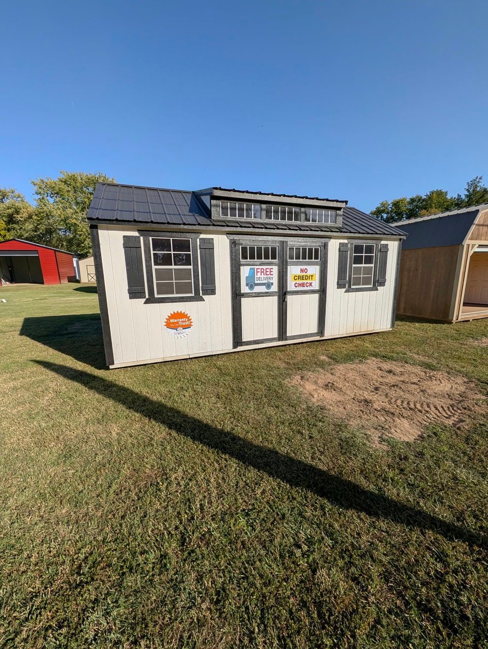 White Prairie Built Sun Studio with double doors and upper windows