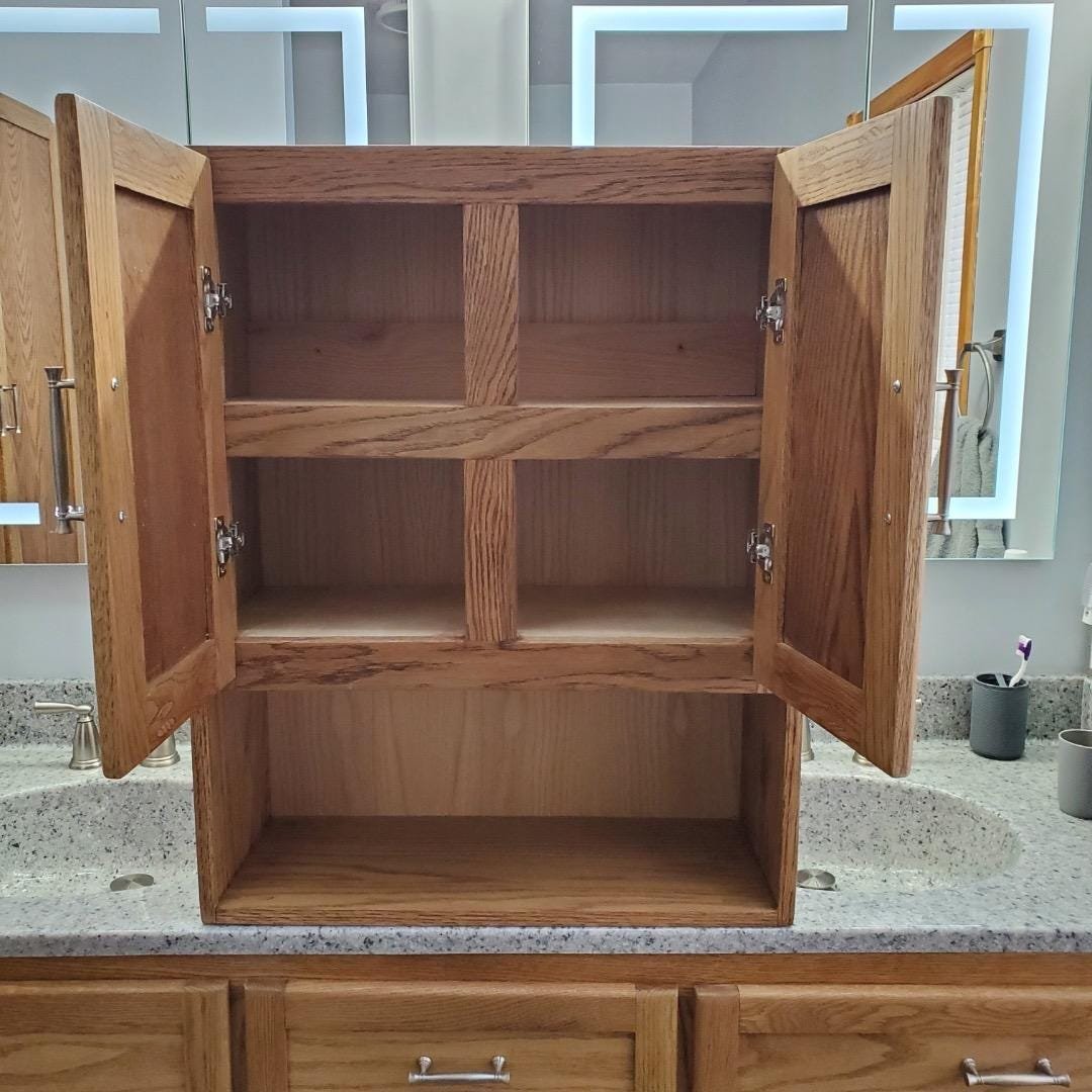 Handcrafted oak display cabinet in a finished room
