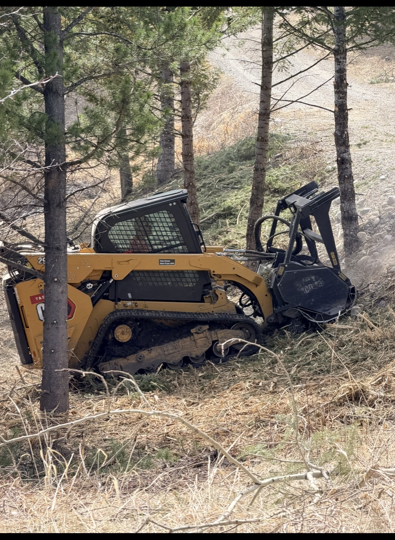 Excavator at work on a rural Montana property