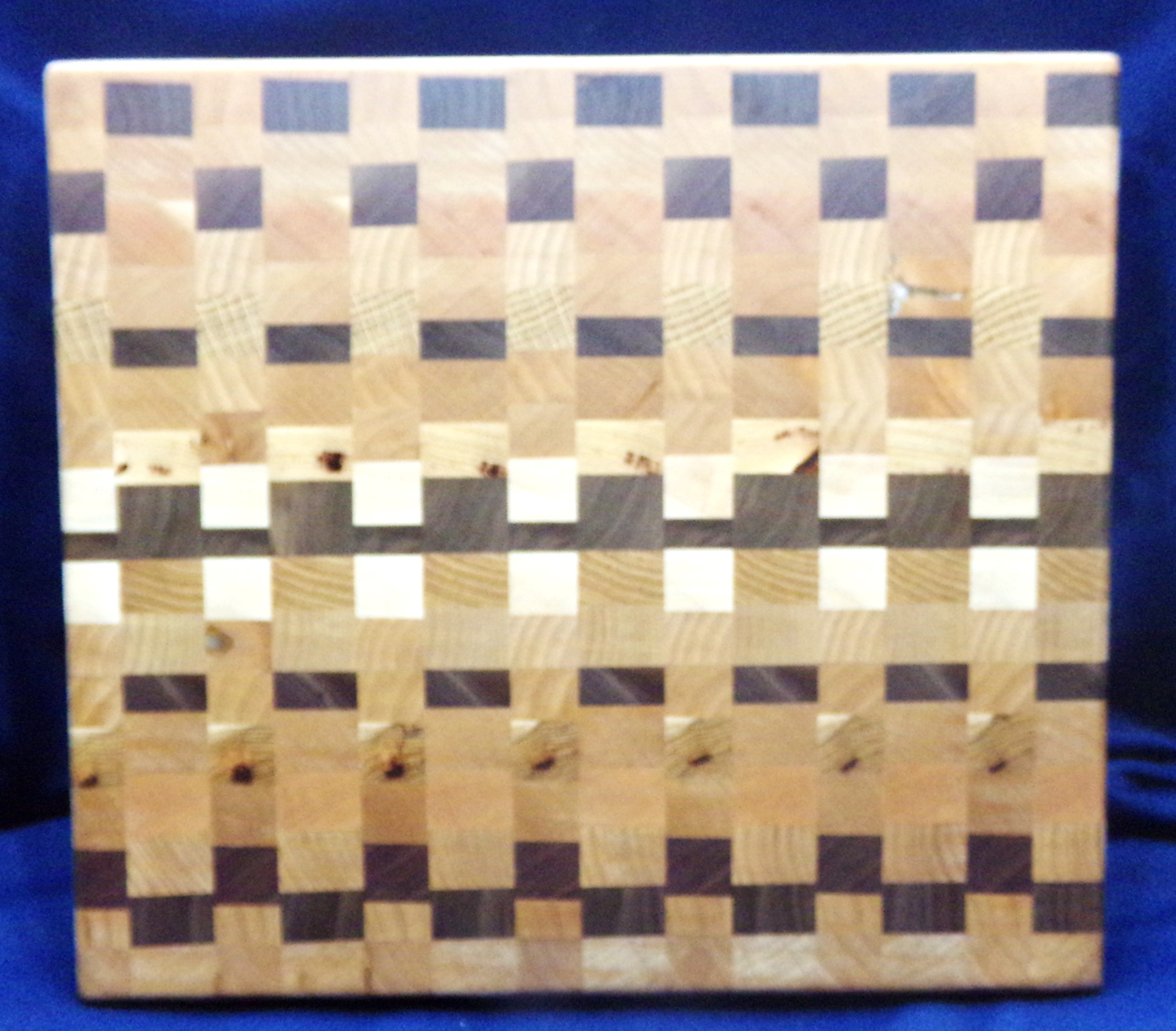 End-grain checkerboard cutting board handcrafted by Juniper Maiden