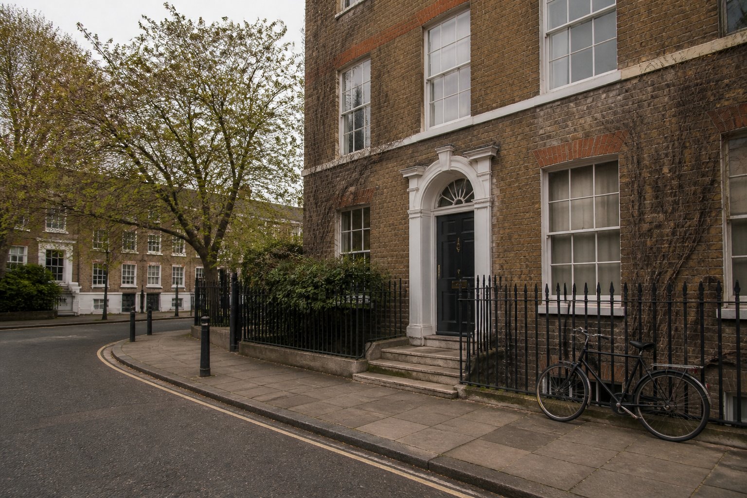 A quiet Georgian street in Bloomsbury with brick terraces and a bicycle